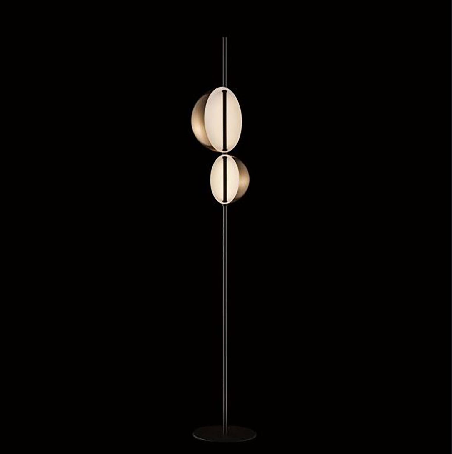 Superluna floor lamp by Victor Vasilev for Oluce. Inspired by Vico Magistretti’s work, Vasilev focused on iconic shapes to improve the potential of the light source. The slender metal rod of the Superluna lamp conceals the electrical components and