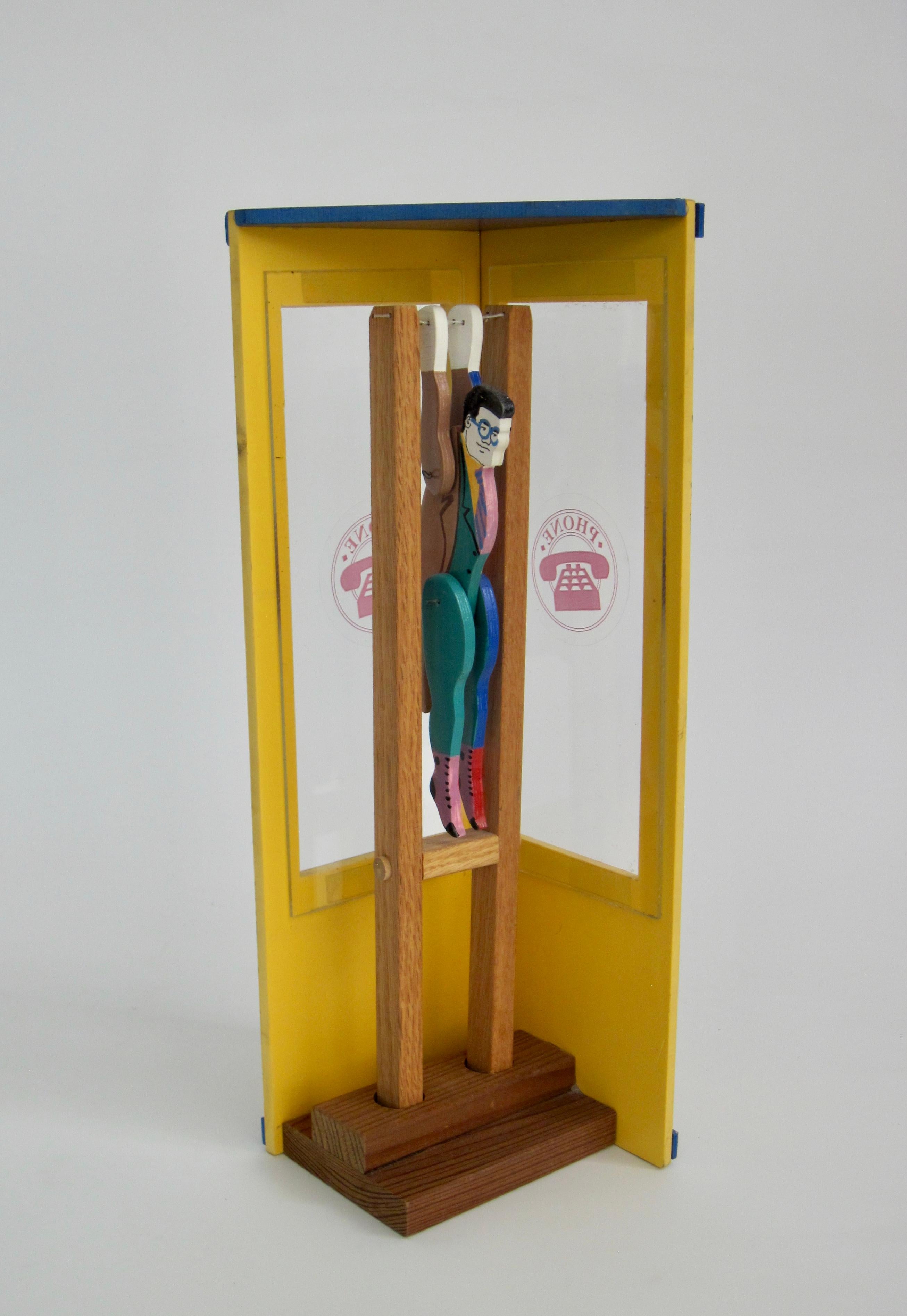 Superman/Clark Kent Wooden Trapeze Artist Toy with Graffiti Phone Booth In Good Condition For Sale In Ferndale, MI