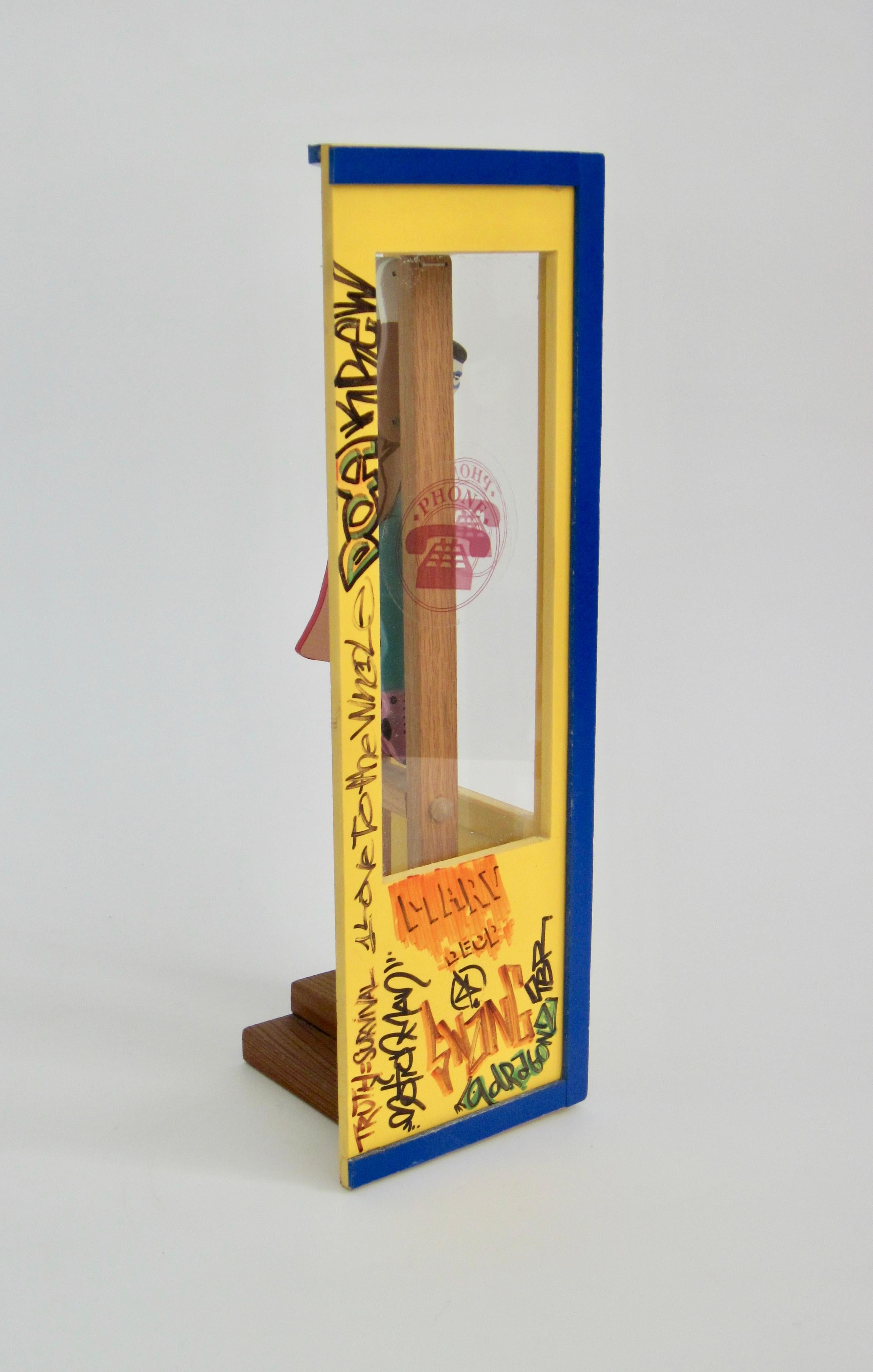 20th Century Superman/Clark Kent Wooden Trapeze Artist Toy with Graffiti Phone Booth For Sale