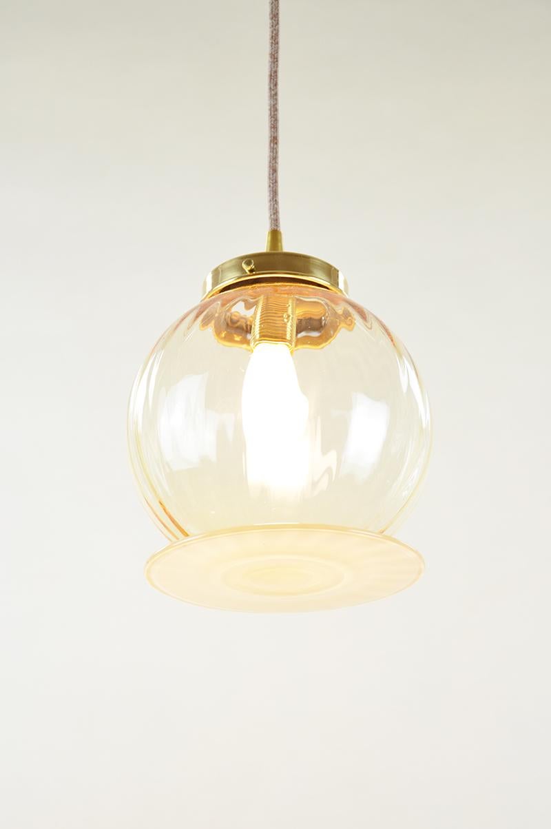 Supernova pendant by Atelier George
One of a Kind
Dimensions: Ø 17 x H 19 cm 
Stem length : 100 cm
For a custom lenght of the cord, please contact us.
Materials: Handblown Glass, Brass fixture
230/240 Volts 50-60 Hz 3 Watt

All our lamps can