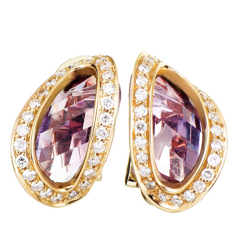 Fascinating play of light upon the unconventionally shaped and exquisitely cut amethyst stones weighing in total 9.80 carats is coupled in these dazzling earrings from Superoro by the glittering diamonds totaling 0.62 carats upon the charming 18K