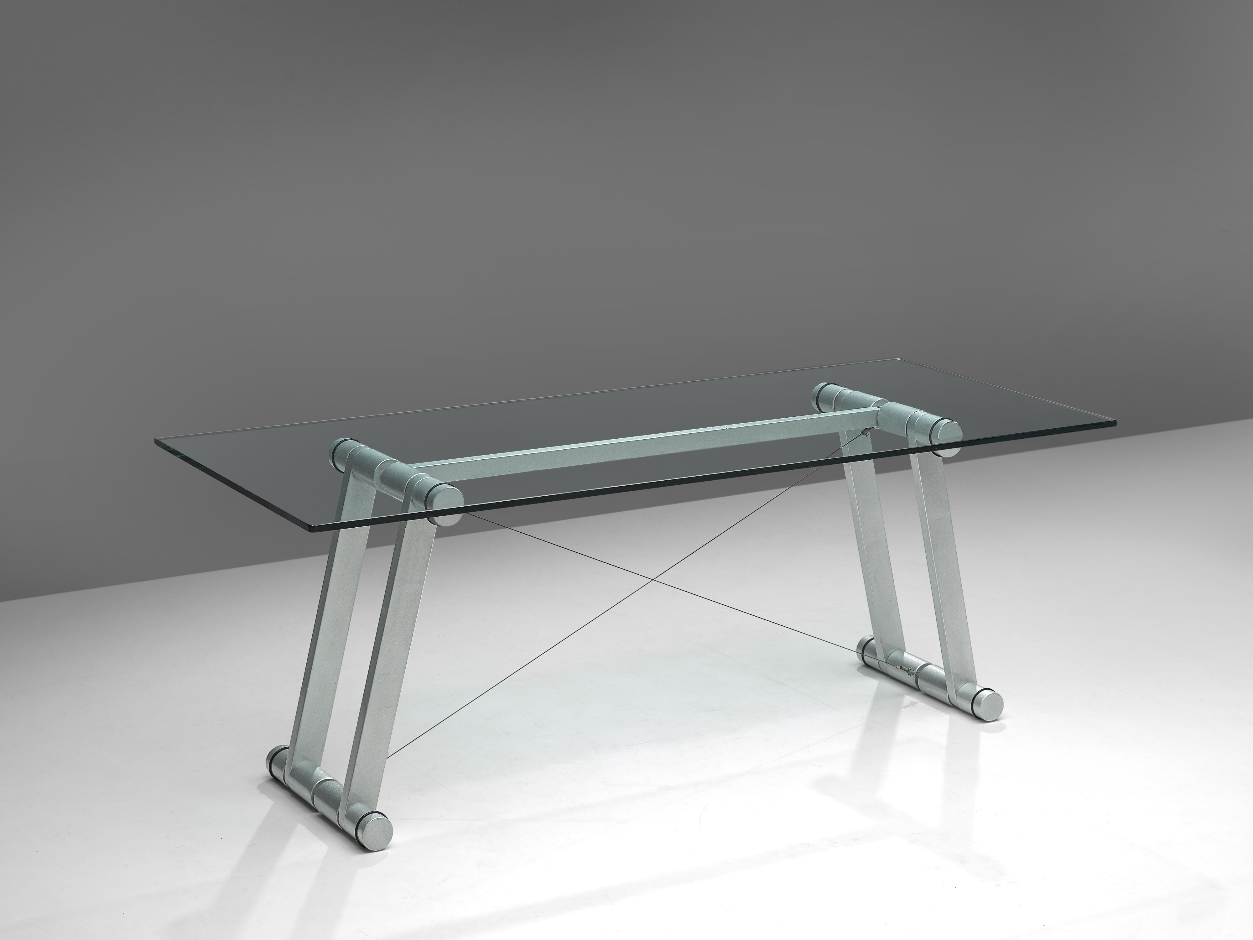 Superstudio, dining table 'Teso', metal, glass, Italy 1970s

Exceptional table by the Italian architecture and design group Superstudio. The rectangular table has a clear glass top. The frame consist of four large tubular legs executed in metallic