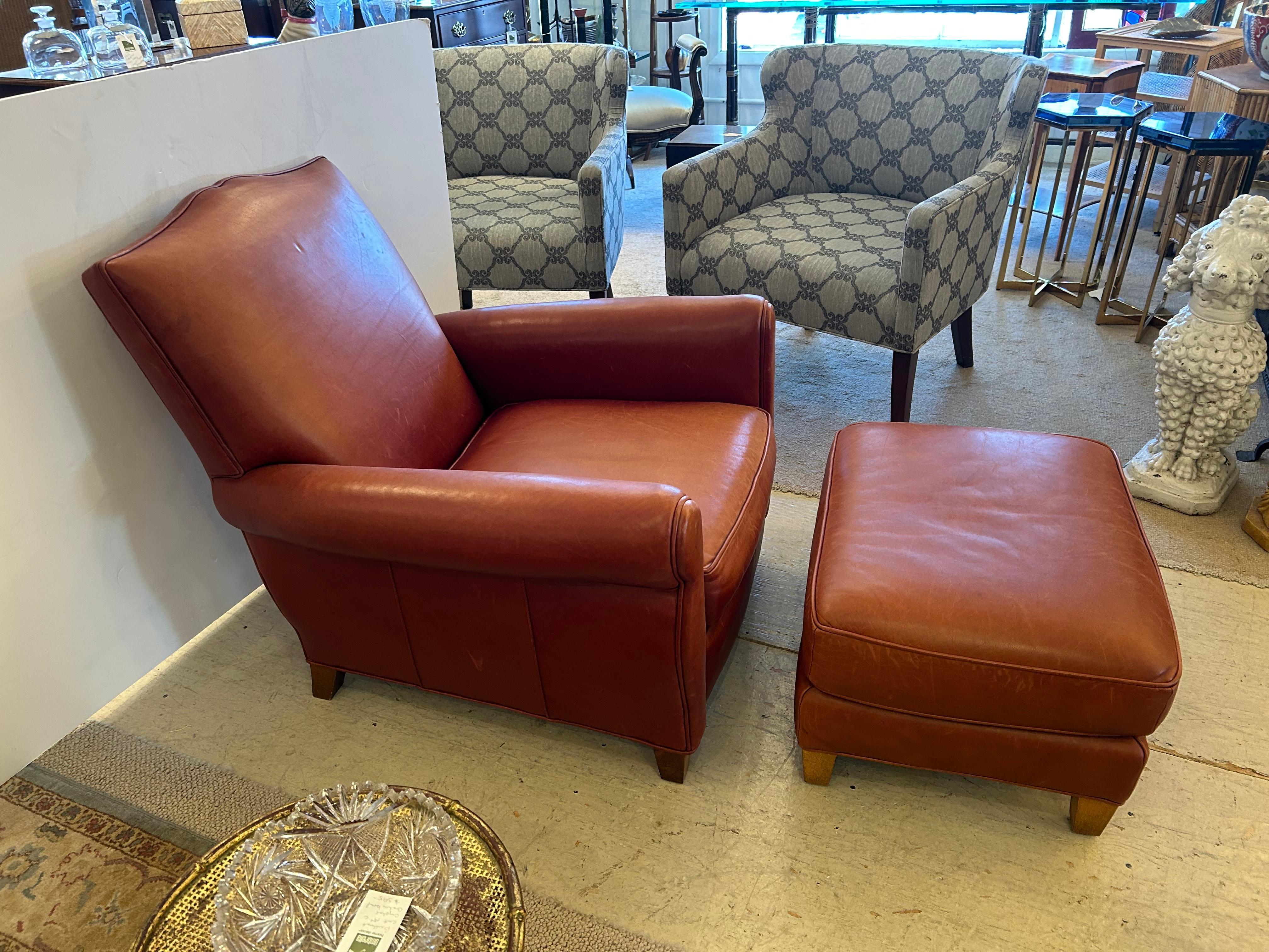 Classic art deco moustache French style supple leather club chair having beatiful seamed back finished with antiqued brass nailheads.  Matching ottoman completes this extremely comfy set.  
Ottoman measures 24 w x 19.25 d x 13.75 h