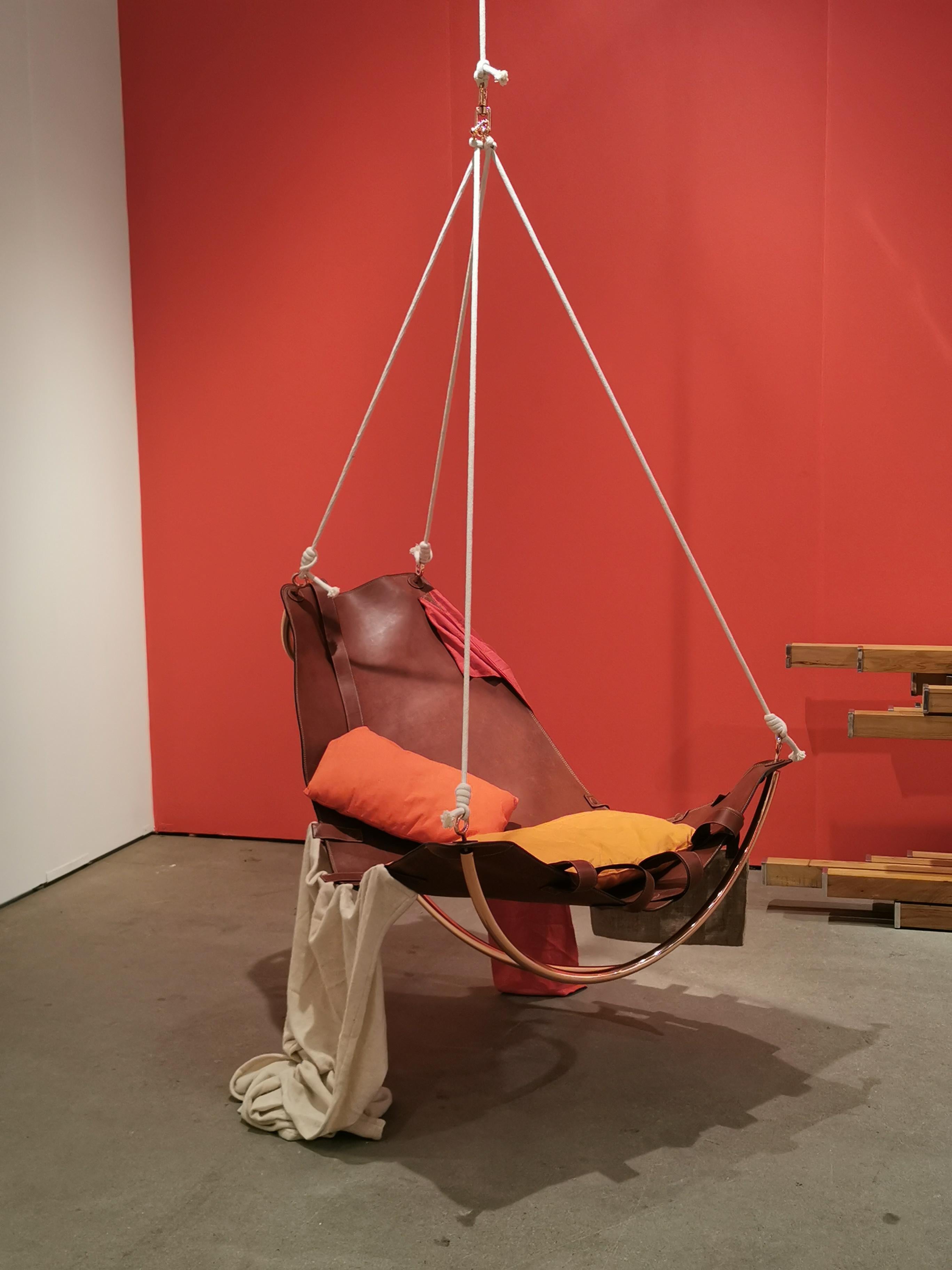 Supra chair by Mameluca
Material:Copper plated steel, leather, Assorted fabrics
Dimensions: D110x W90 x H90 cm

Hélio Oiticica’s Parangolés inspired the creation of a rocking chair Supra (Super). Fabrics, cloths, plastics and other materials