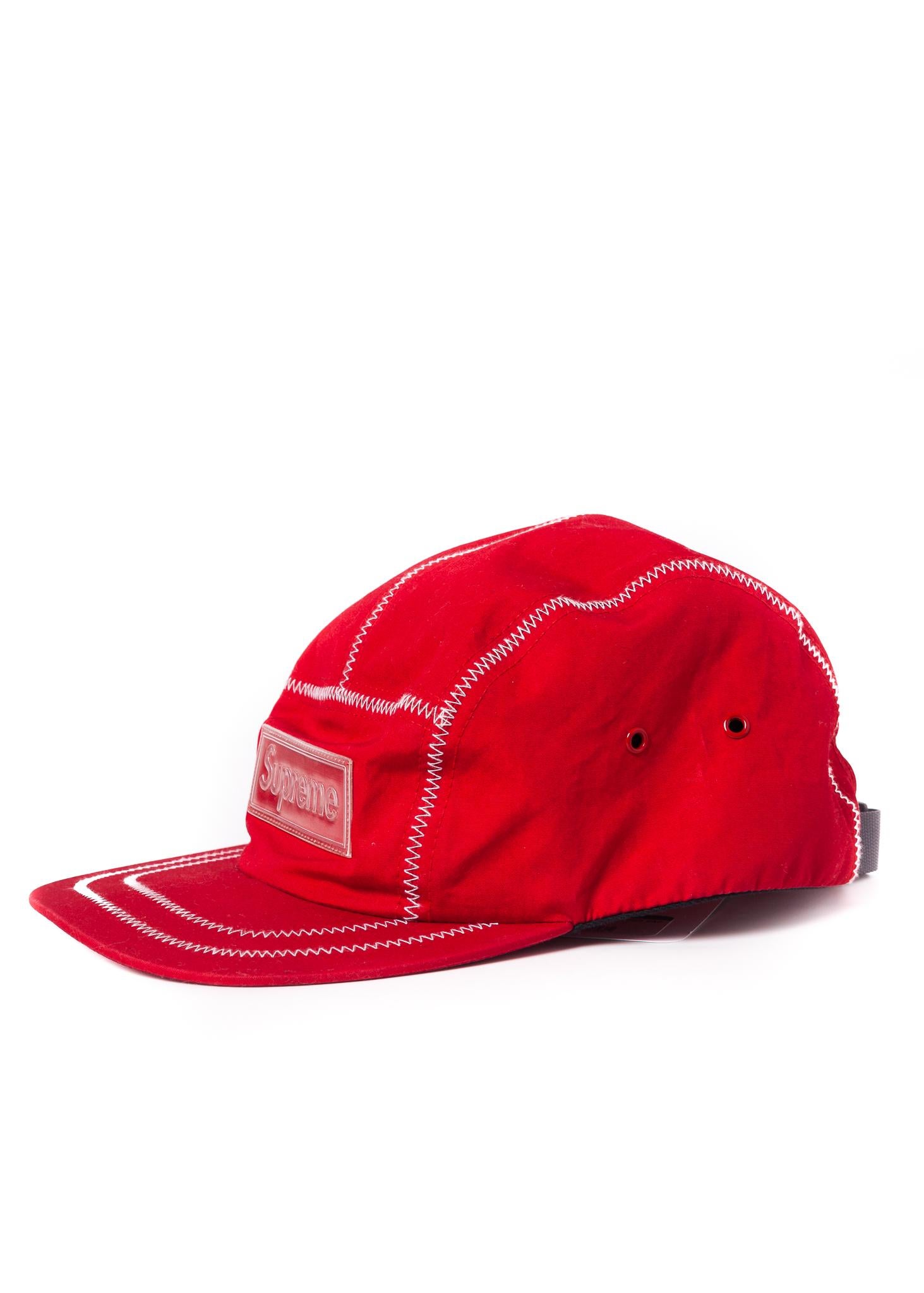 Supreme Logo cap with an adjustable fit.

COLOR: Red
MATERIAL: Cloth
SIZE: Adjustable
CONDITION: Good - hat looks pristine. Front of the hat looks adjusted to curve. Used as store display piece.