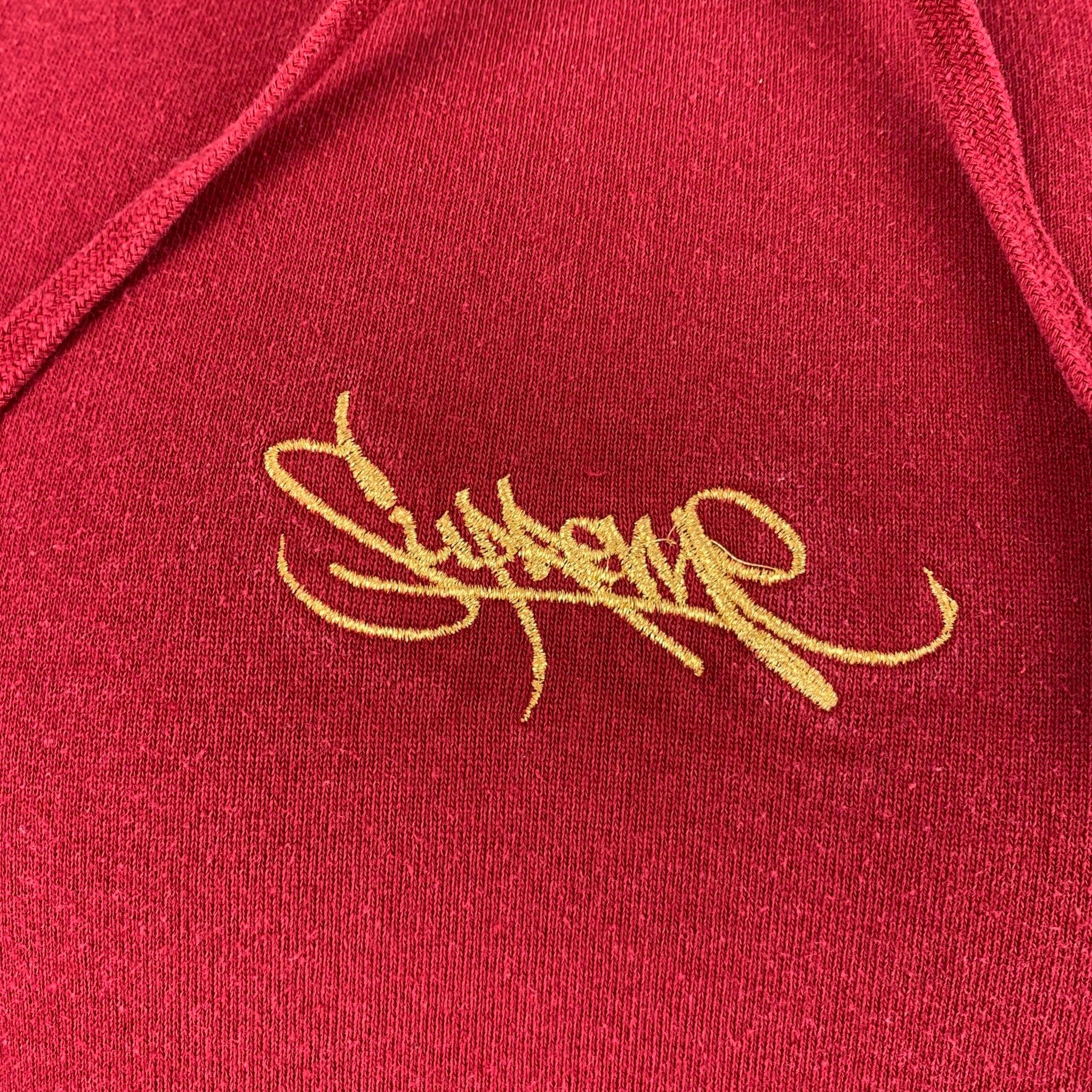 SUPREME sweatshirt
in a
burgundy cotton knit featuring a hooded style, gold Supreme embroidery, and kangaroo pockets. Made in Canada.Very Good Pre-Owned Condition. Moderate signs of wear. 

Marked:   M 

Measurements: 
 
Shoulder: 19 inches Chest:
