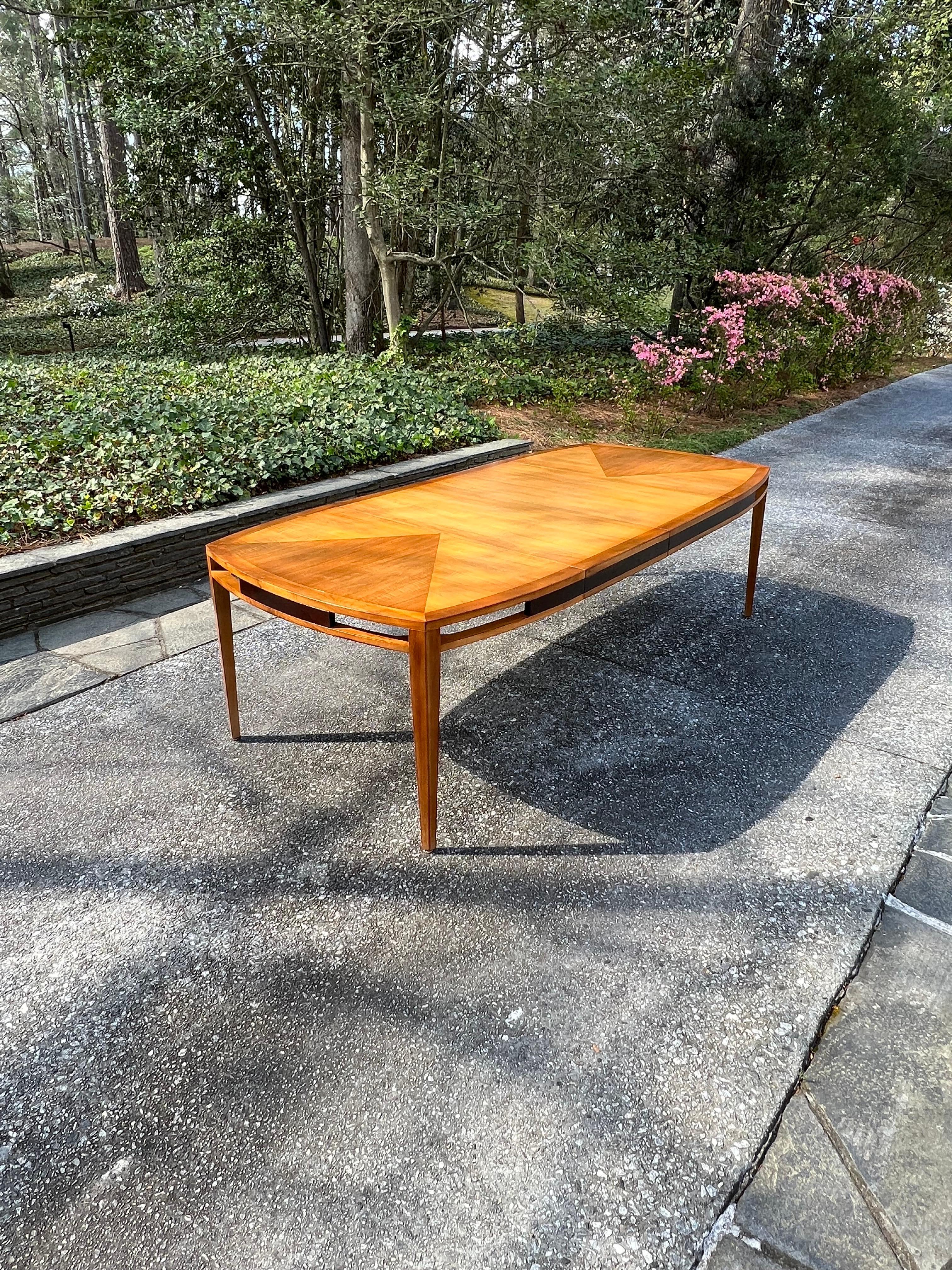This magnificent dining table is shipped as professionally photographed and described in the listing narrative: Meticulously professionally restored and installation ready. This rare Taylor example is unique on the World market.

A breathtaking