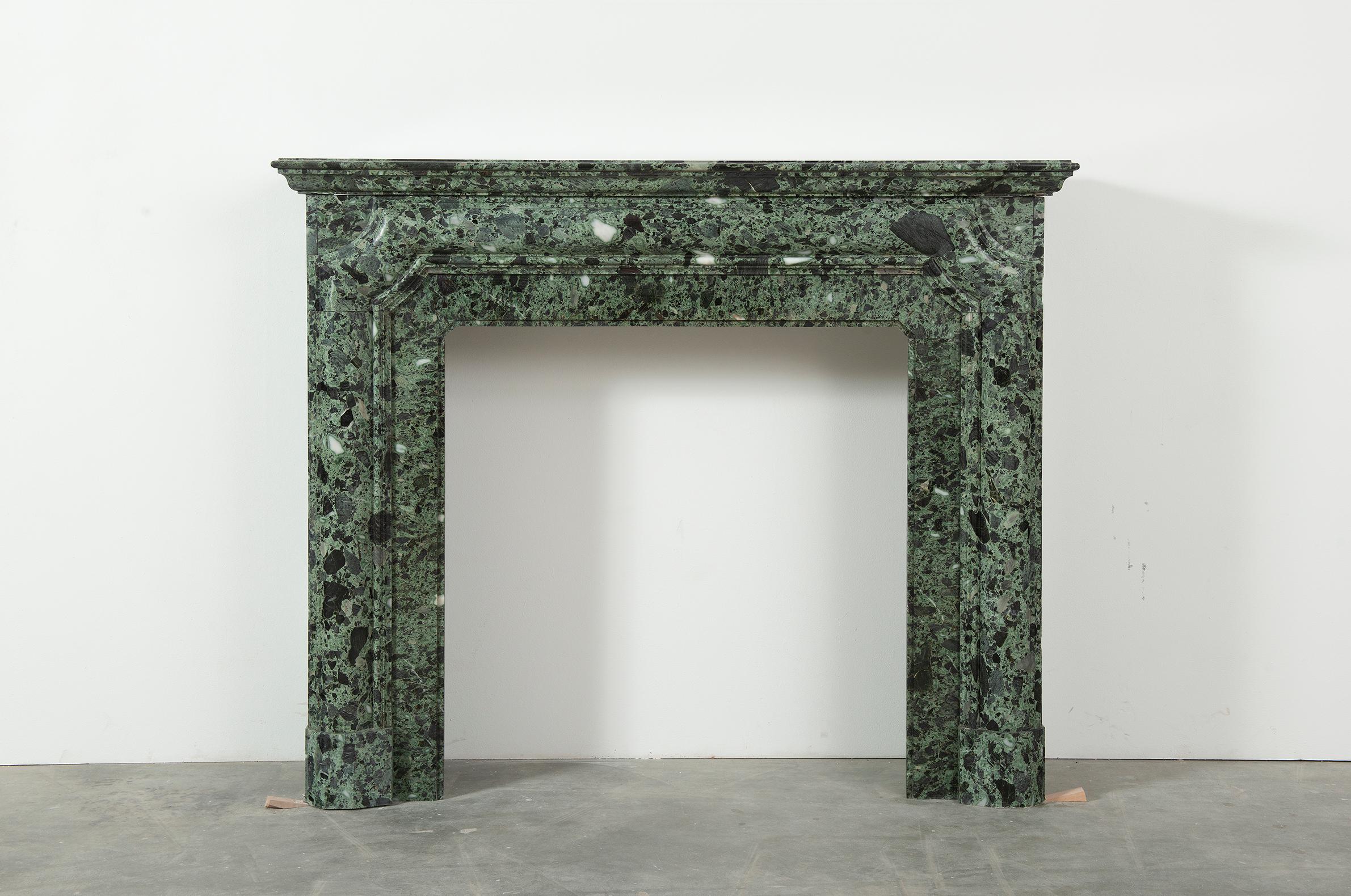 A very nice 19th Century fireplace mantel in Verde Antico marble, this lovely green, white-mottled marble has a beautiful high polished gloss. 
The nice tall ratio of this mantel makes it very suitable for smaller spaces with high ceilings, is can