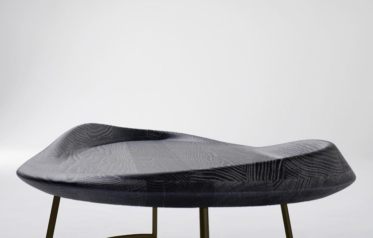 A coffee table inspired by the clean lines of a surfboard. The edges of the Surf Table are evocative of an undulating wave lapping at the board. The sinuous and sensual form of the Surf Table was handcrafted from oak, which was selected for both its