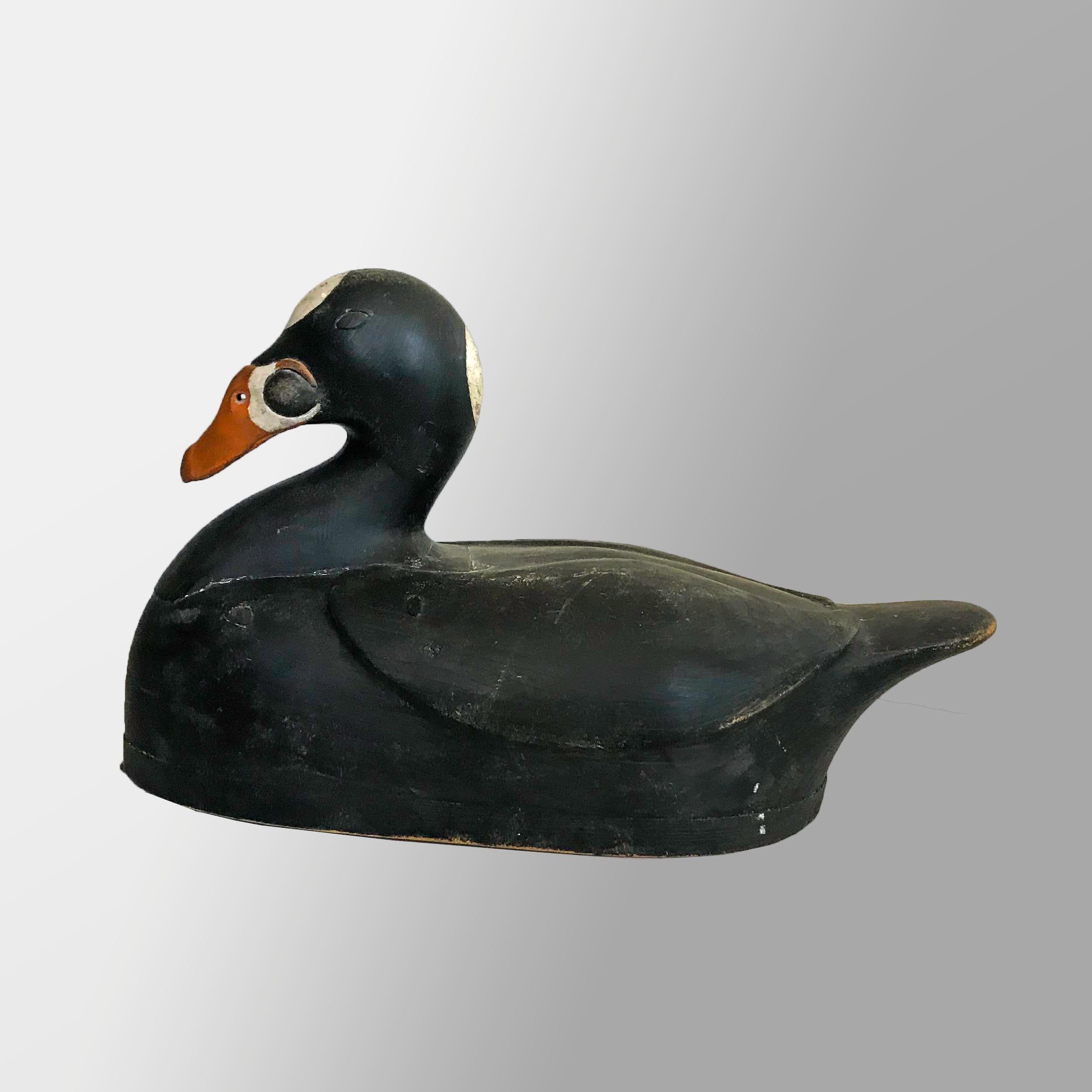 Carved and painted in the Gus Wilson Manner by master contemporary carver and folk artist Frank Finney with relief wing carving and hollow body. Superb detail to head.
Signed on underside with block letters, “FF 1