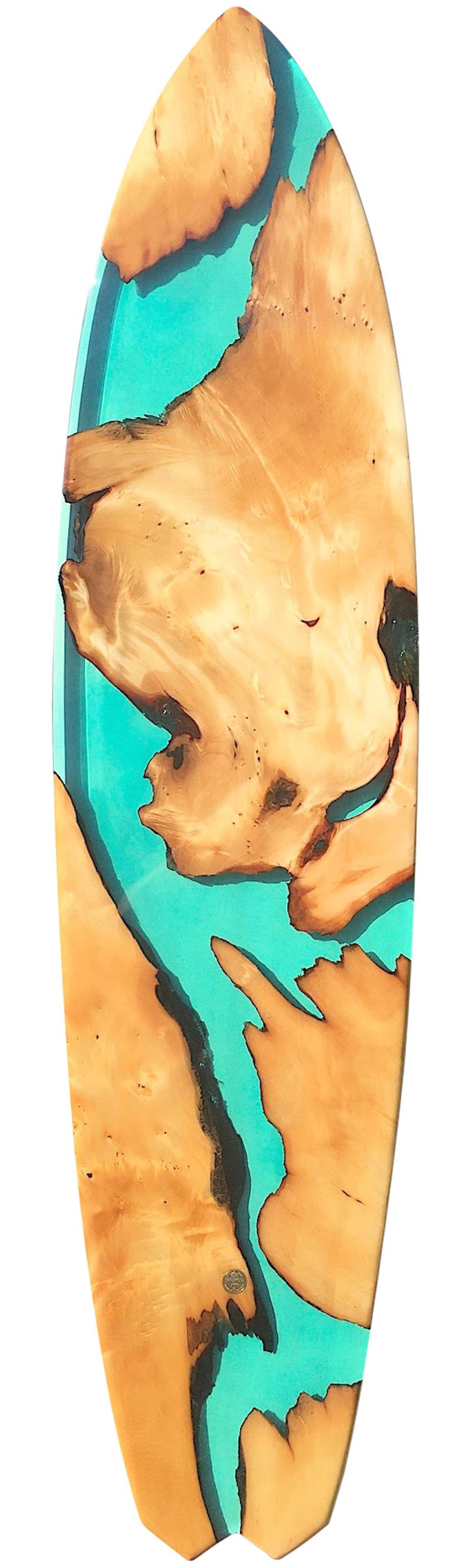 One of a kind “Harlequin Shores” finless surfboard work of art by Australian artist Joshua Marks. Featuring Huon Pine natural edge wood composition with chameleon pigment, fused with clear turquoise epoxy resin.