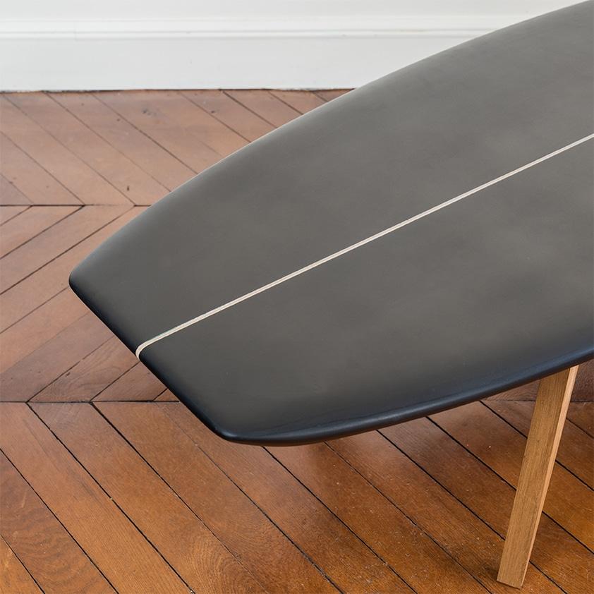 This modern coffee table, takes its inspiration on the Classic design on surfboard, which has intentionally shortened.
The rafine shape combined to the base inspired by Prouvé's gives a modern look to the table.

Young, forceful, and free, the