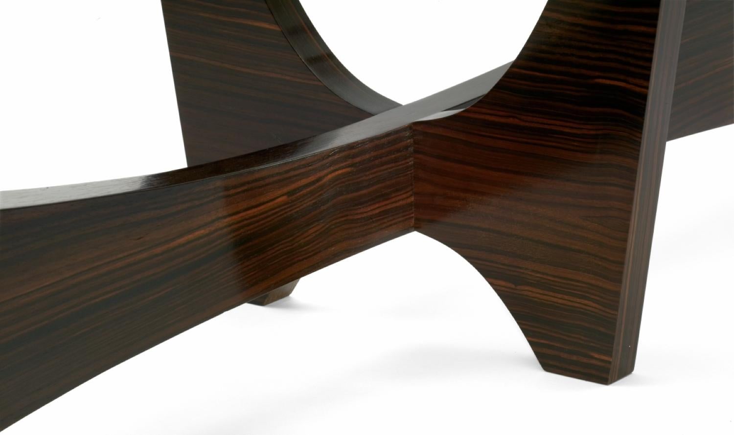 Surfboard shaped cocktail table in Macassar ebony and hand worked glass.

Available now in Inventory dimension: 21
