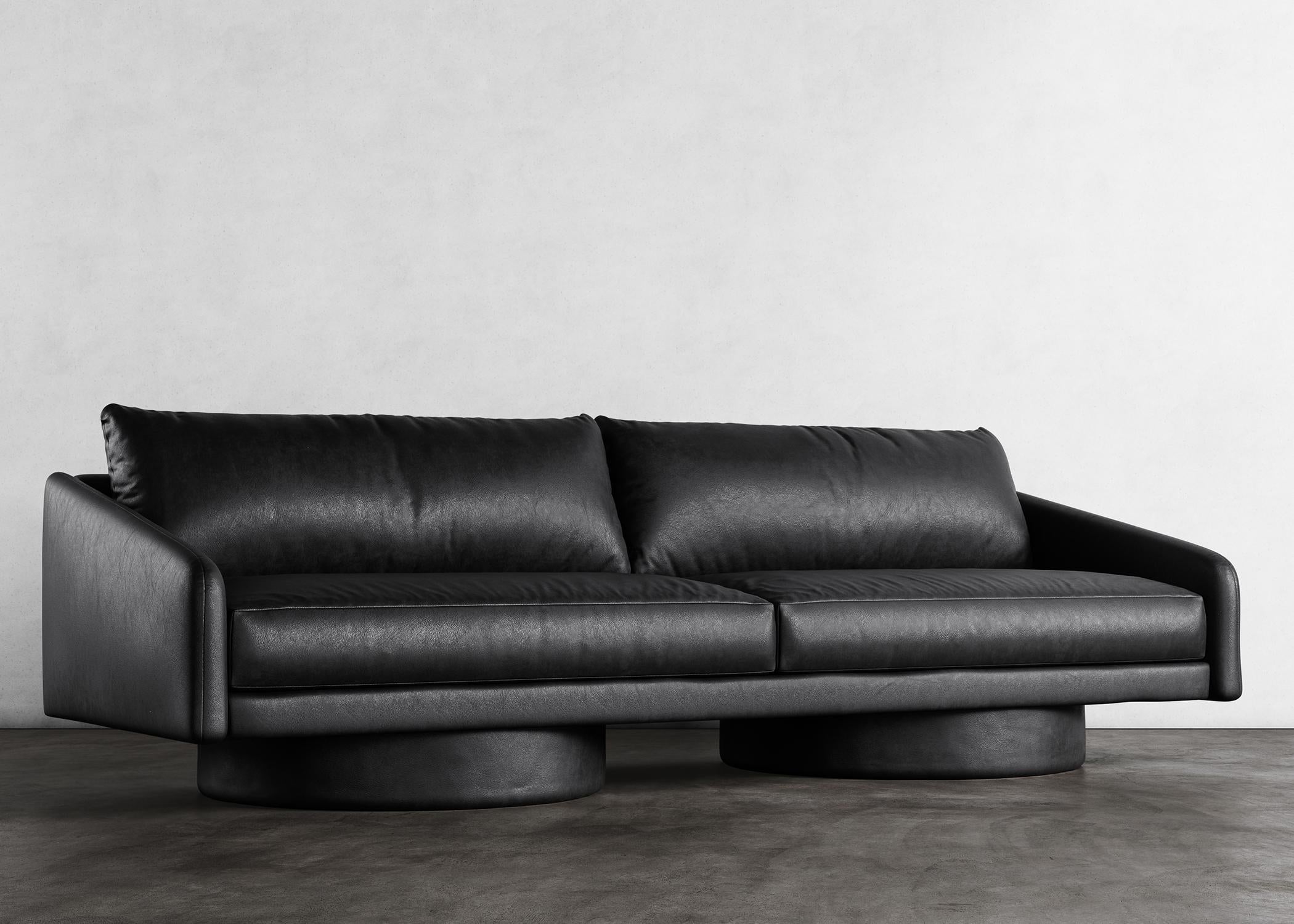 SURGE SOFA - Modern Sofa in Black Faux Lambskin

The Surge Sofa in black faux lambskin is a luxurious and stylish piece of furniture that is perfect for any modern living room. This sofa features a sleek design with clean lines and a minimalist