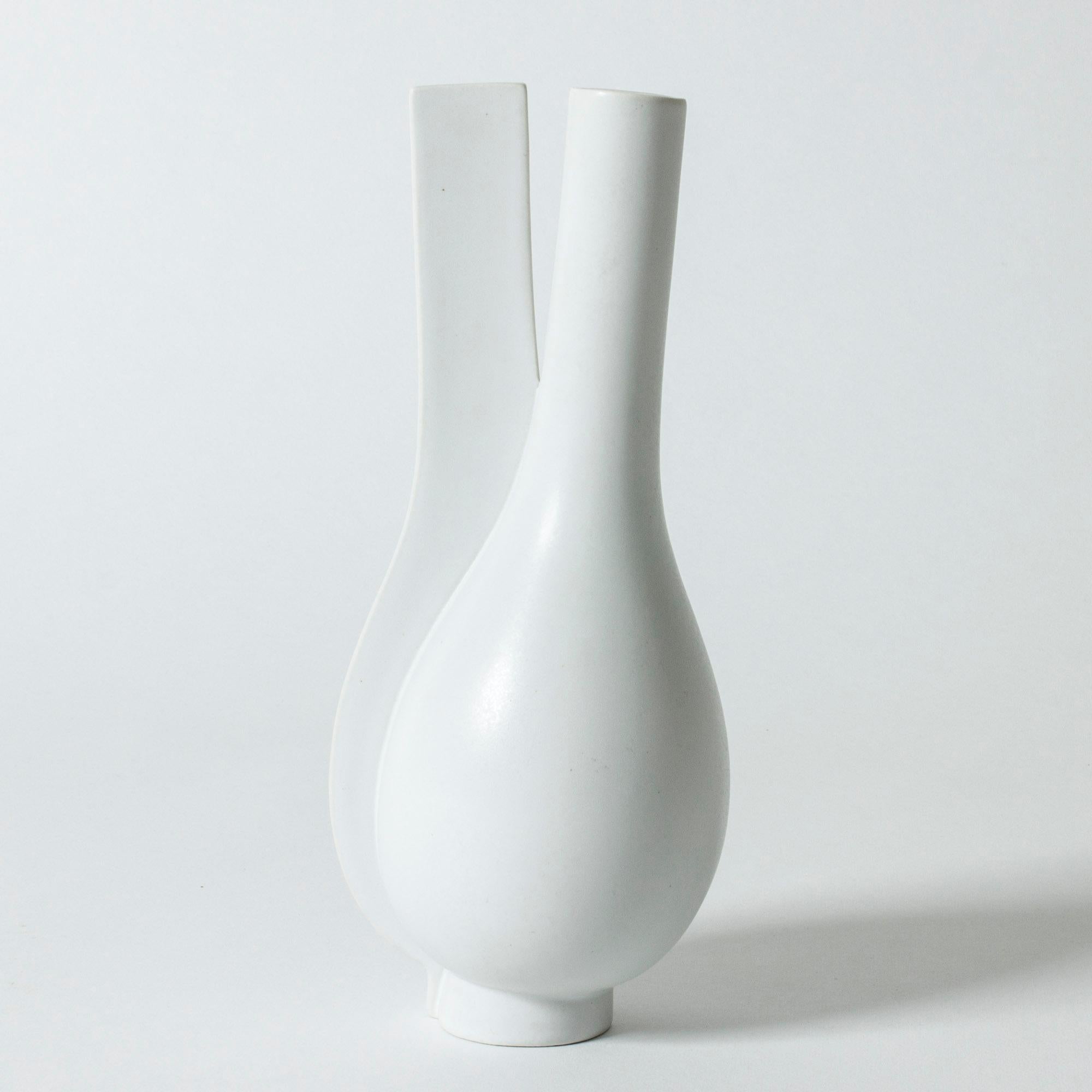Beautiful “Surrea” vase by Wilhelm Kåge, with a striking, skewed form. Glazed with white carrara glaze. Very cool shadow effect.

The “Surrea” stoneware series was first introduced in 1940, inspired by purism and the work of Le Corbusier. It