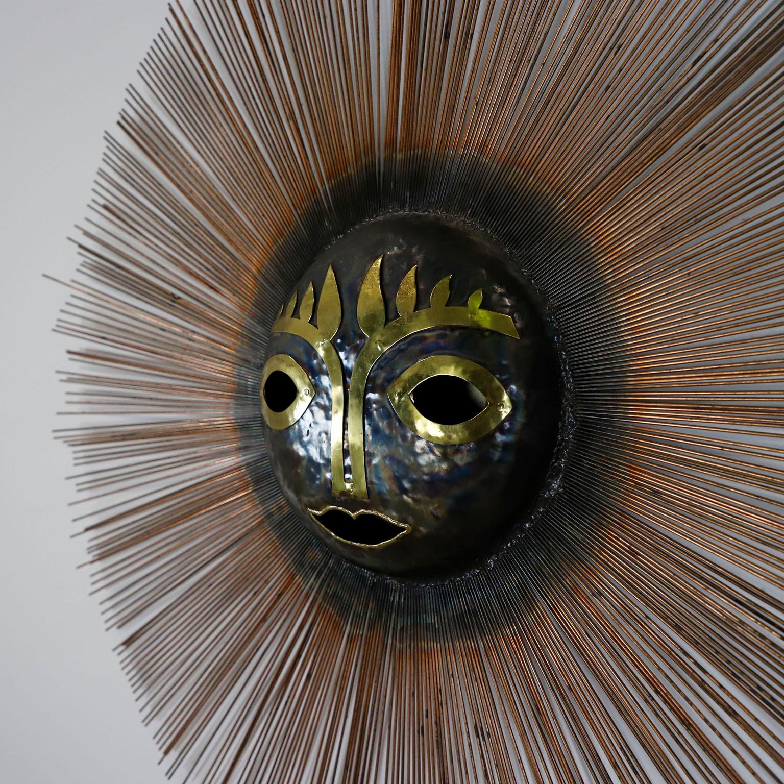 We offer this surreal brutalist sun sculpture in brass and bronze by Emaus Benedictine Monks, circa 1970. Emaus the name of the workshop of the Benedictine Monks of Cuernavaca in the State of Morelos in Mexico.