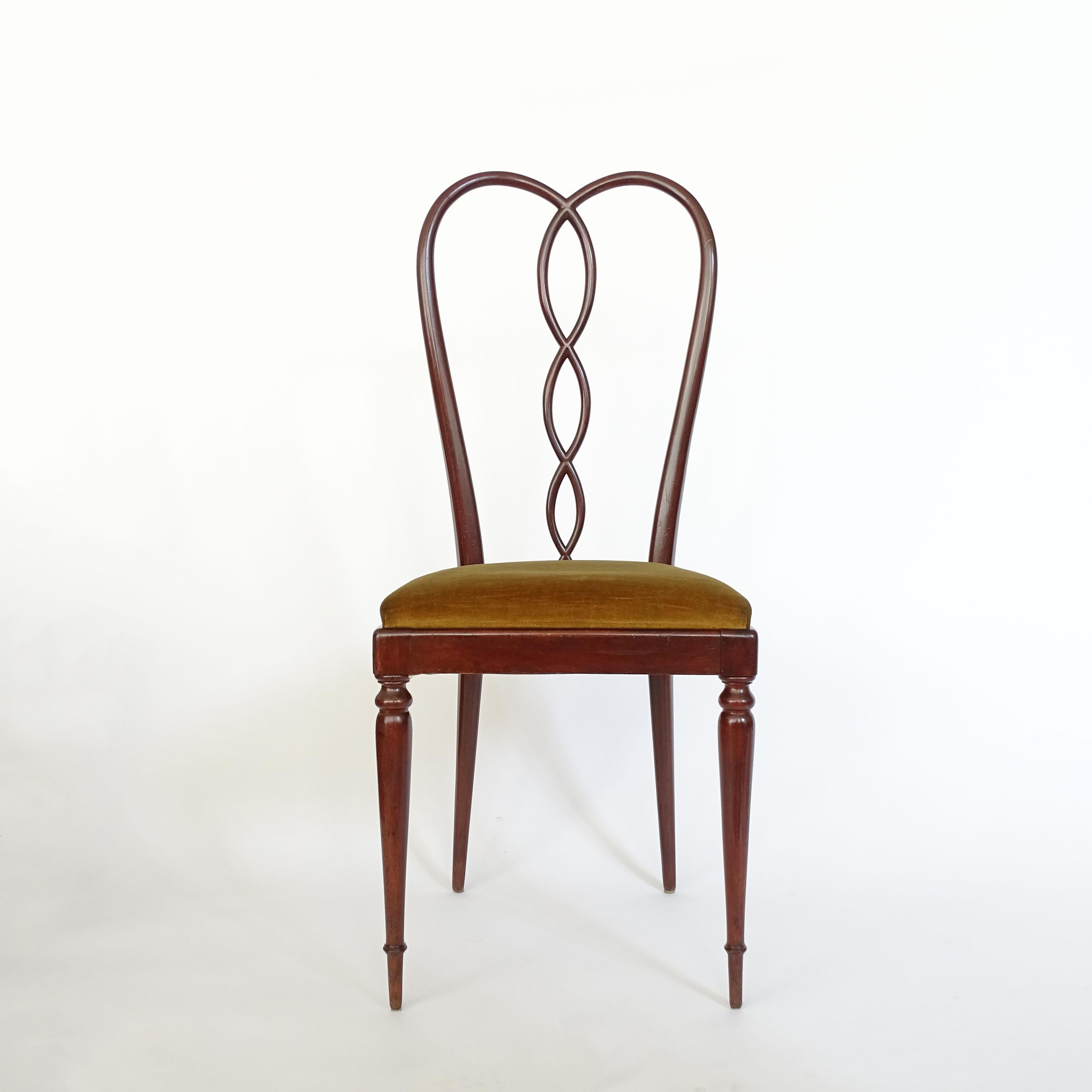 A sublime pair of surreal sculpted chairs in wood and velvet upholstery.