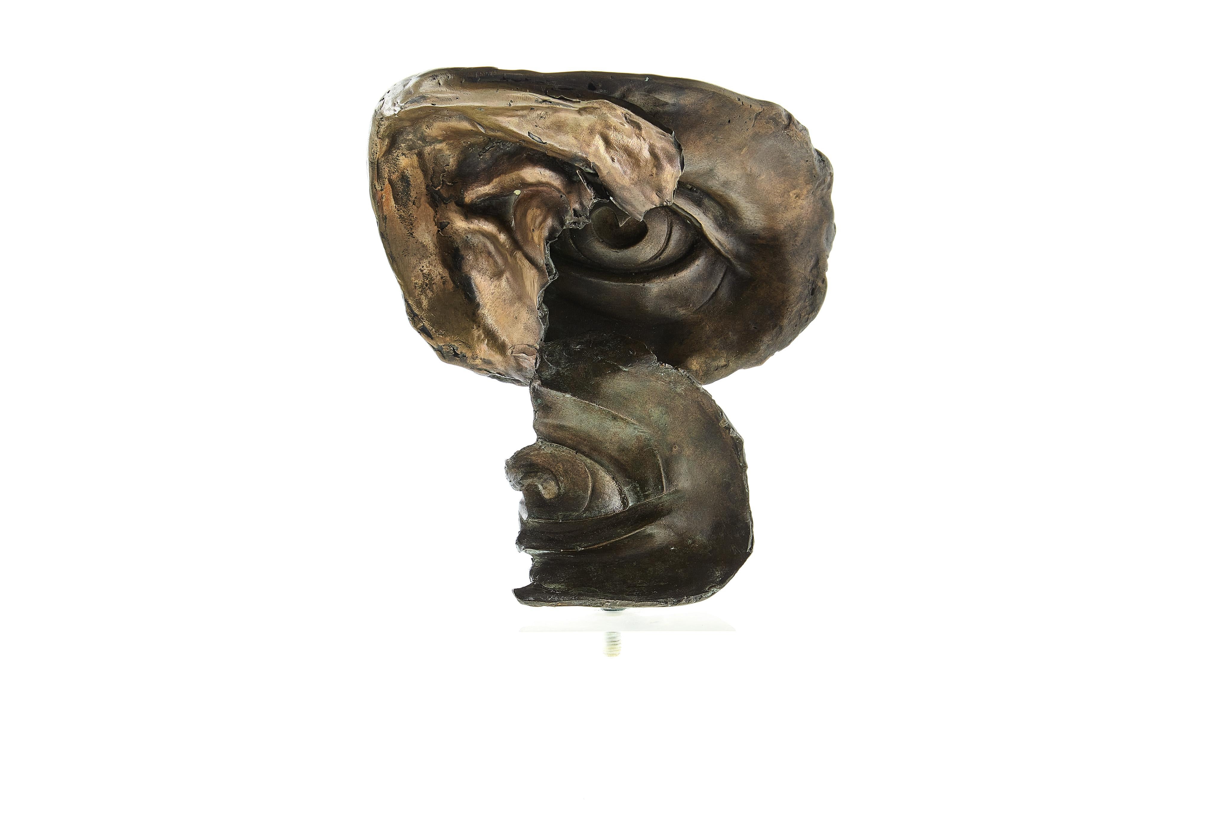 Surrealist bronze on Lucite base, signed 1992. Depicting a face folded over itself in an elegant yet very surreal manner.