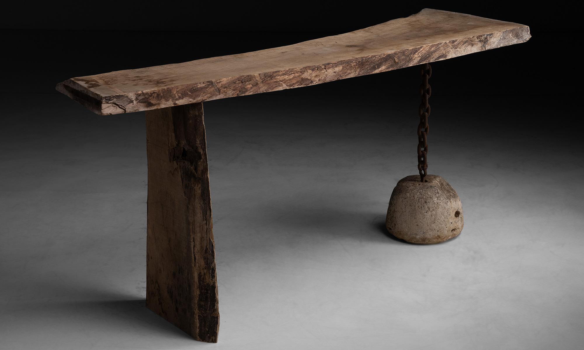 Surrealist console.

France, circa 1960

Composed of wood, concrete and iron chain.

Measures: 71.5”L x 24”D x 32”H.