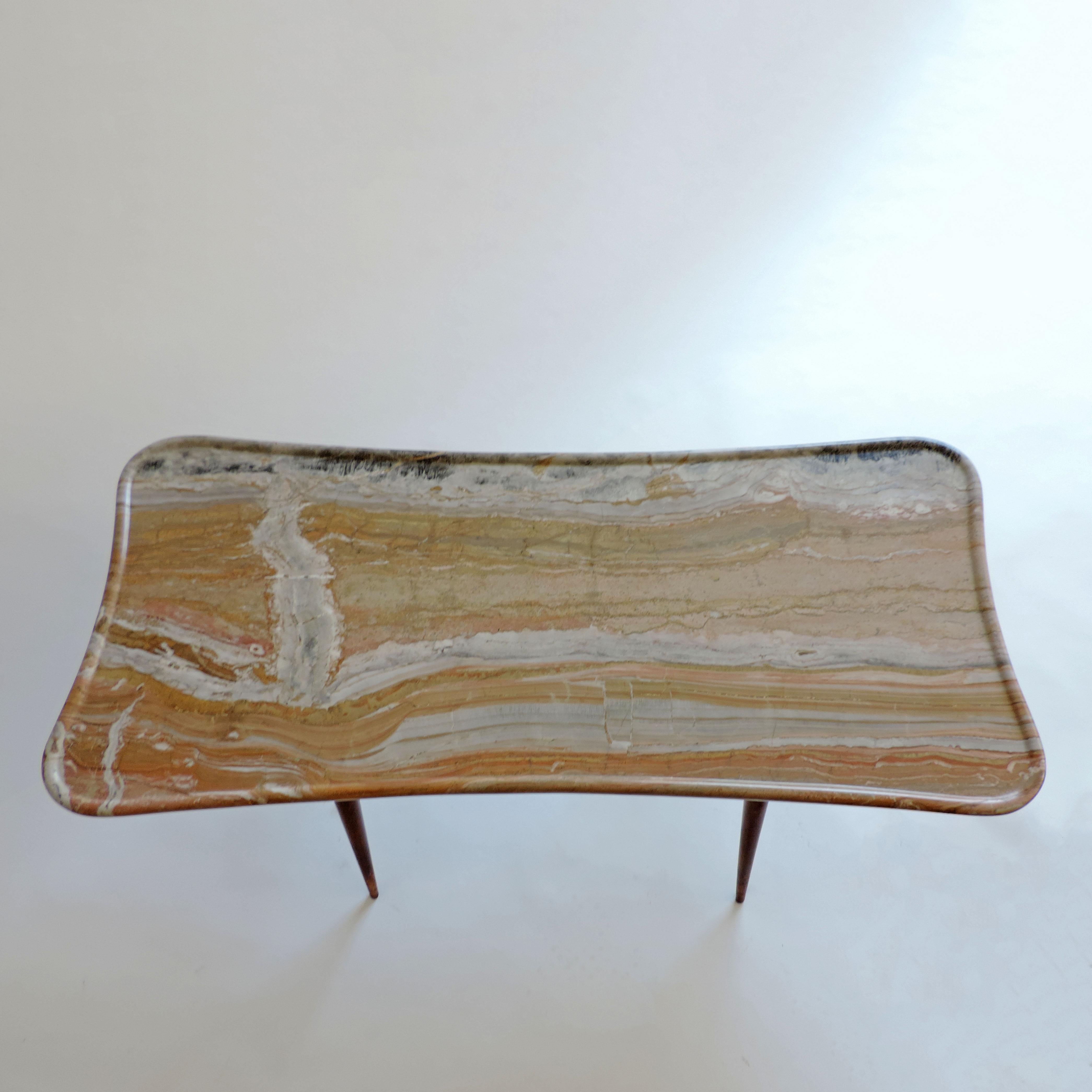 Rare Surrealist Fabrizio Clerici coffee table in wood and sculpted marble.
Italy 1940s.