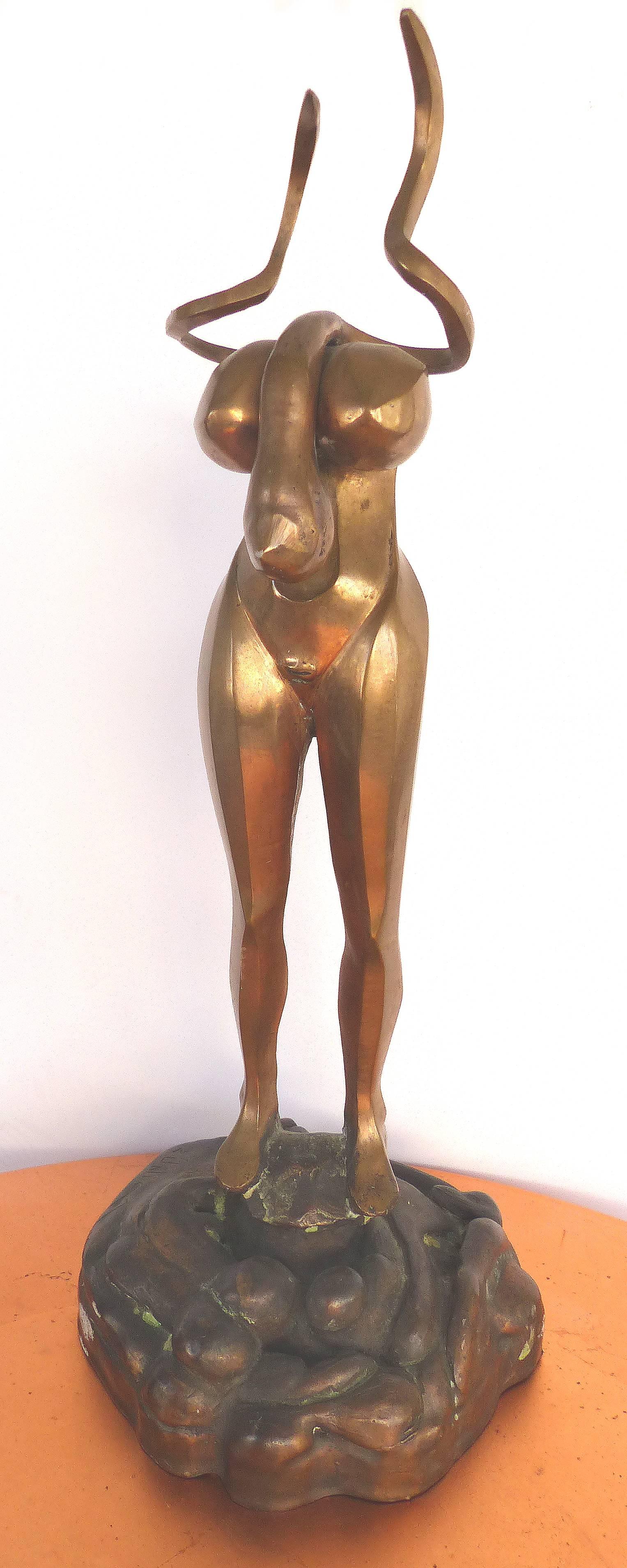 Surrealist Figurative Bronze Signed Zuñiga and Dated, 1977

Offered for sale is a rare estate find of a gilt and patinated bronze of a surrealist standing figure with grotesque features. Signed Zuñiga on the patinated base and dated 1977. As we are