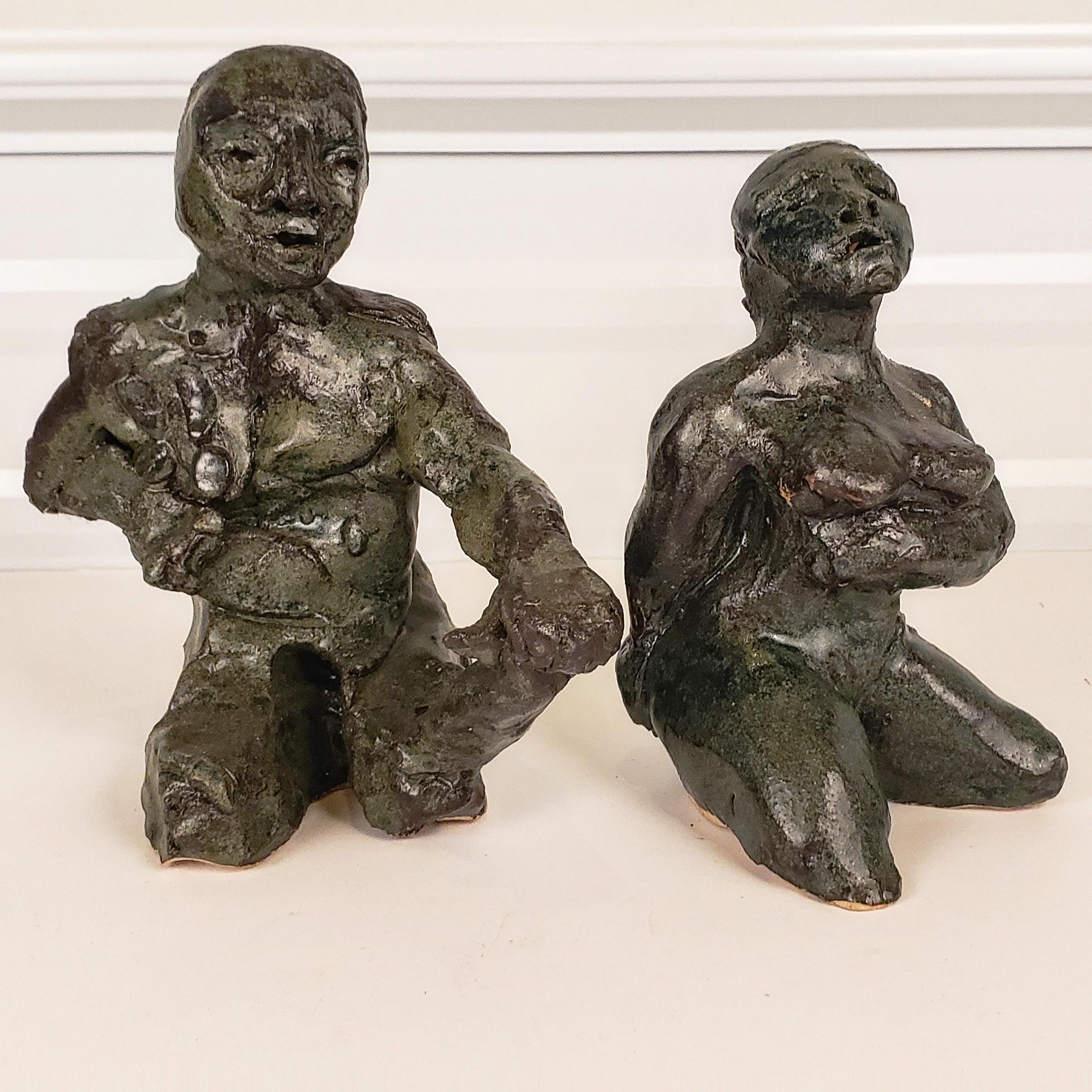 A strong pair of sculptures by Italian American artist Marco Celotti.
 Created circa 1970. This highly animated pair of characters can only bring to mind thoughts of storytelling. Perfect for table top decorating. These figures vary in size, Male
