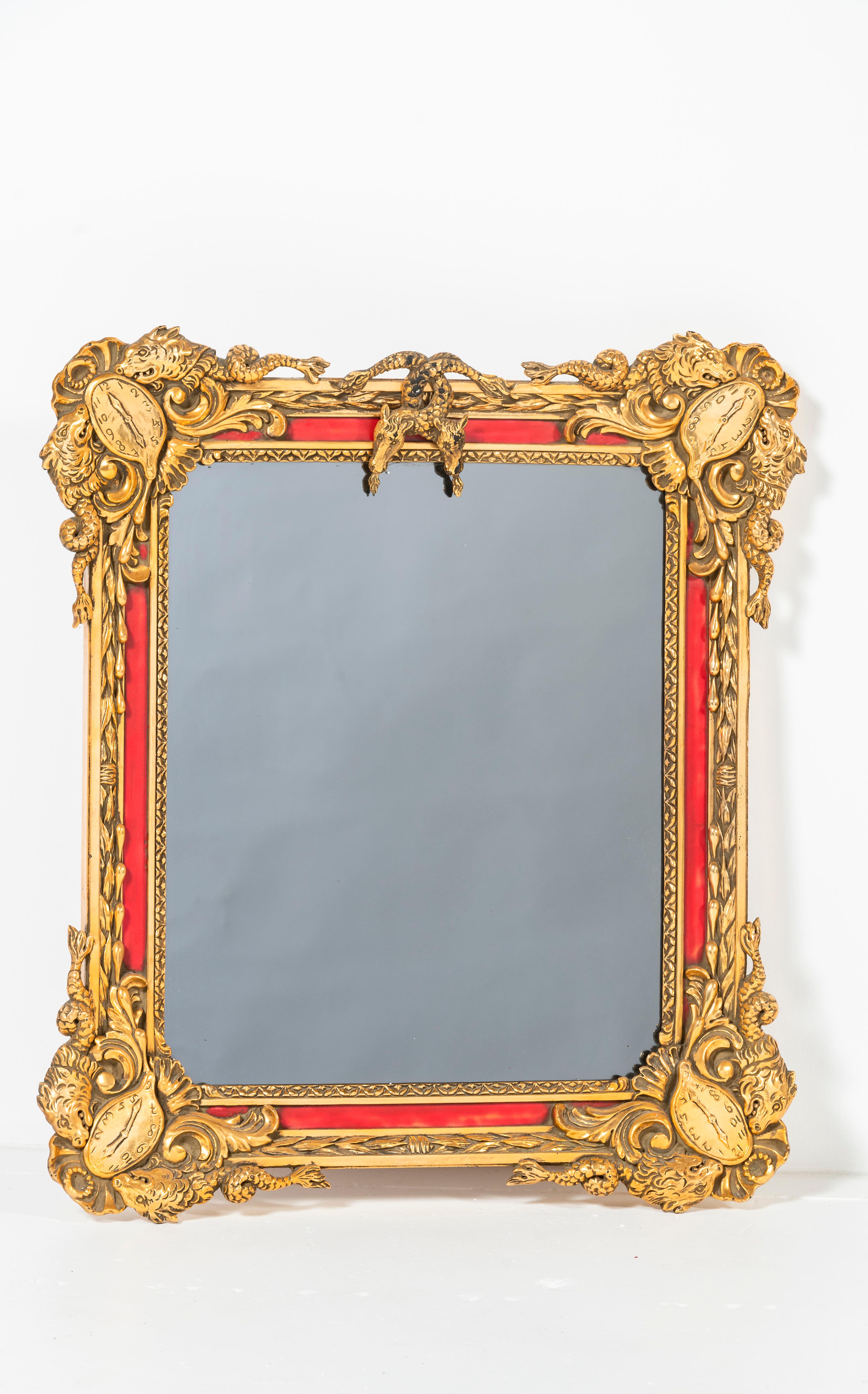 Surrealist mirror by Salvador Dalí (1904-1989). Mirror is framed in cast century wood, gesso, gold leaf, and paint. This captivating piece features imagery of his melting clocks from 