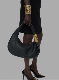 Surrealist Schiaparelli PIERCED VISAGE CUFF BRACELE thammered gold brass cuff