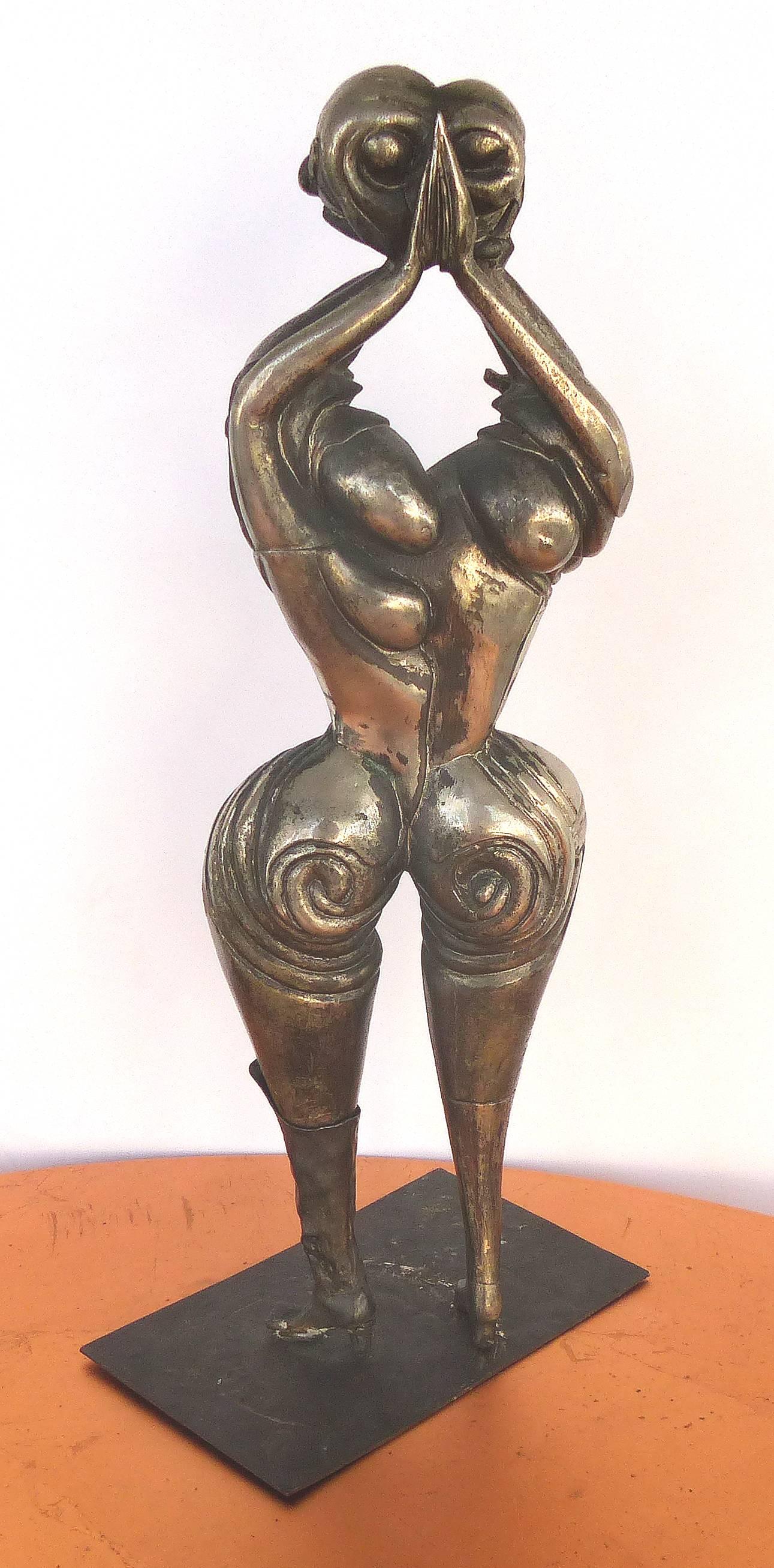 Offered for sale is a wonderful surrealist figurative silvered bronze sculpture of a two-faced modernist figure with a boot on one leg and an iron base. Base, 5.25