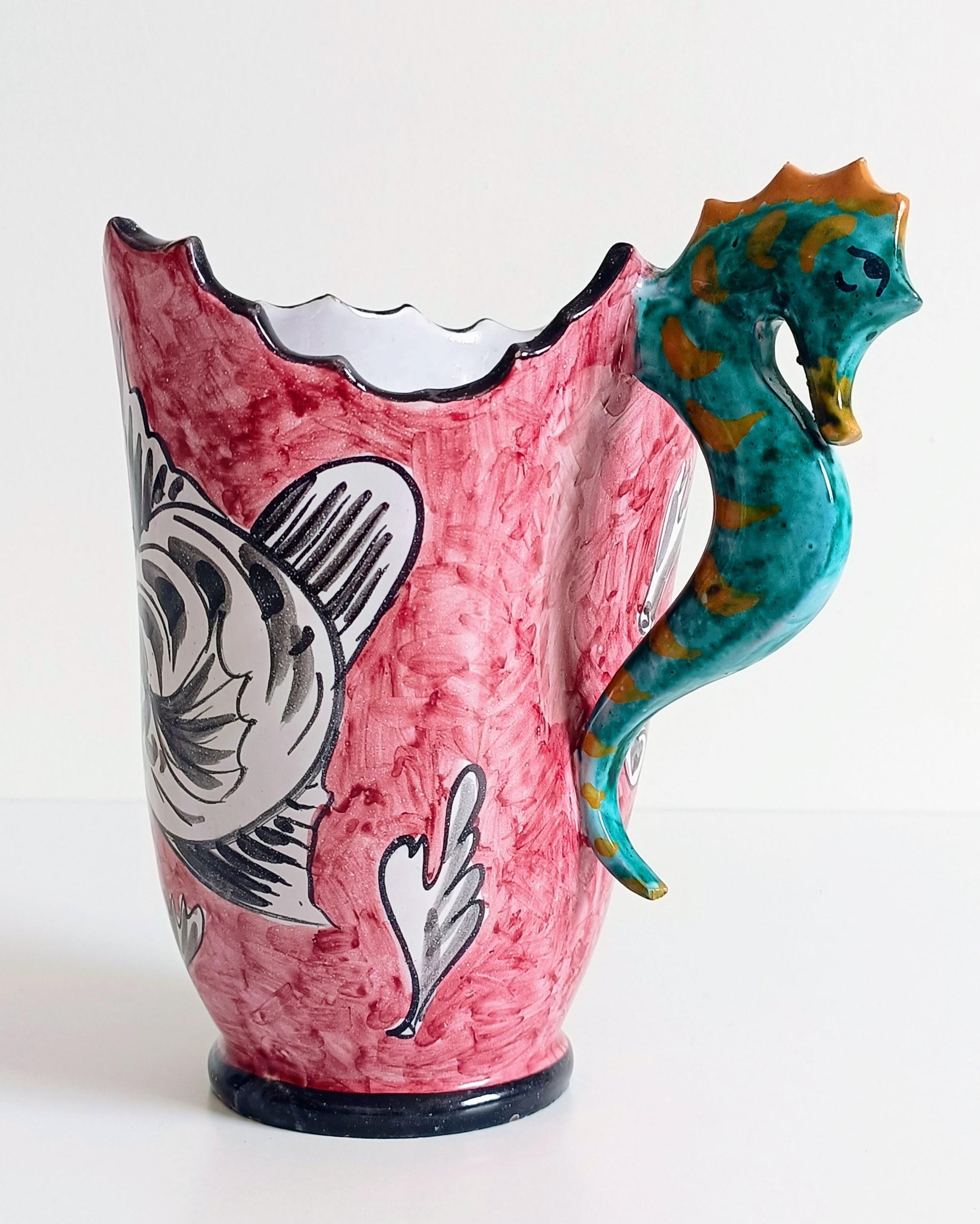 Unique Surrealistic Faience / Majolica Vase-Pitcher with Seahorse Handle by Alabbo Amalki, RC Italy

A very unique and highly decorative faience (majolica) vase-pitcher, showcasing a surrealistic sculptural design. The piece features a wavy,