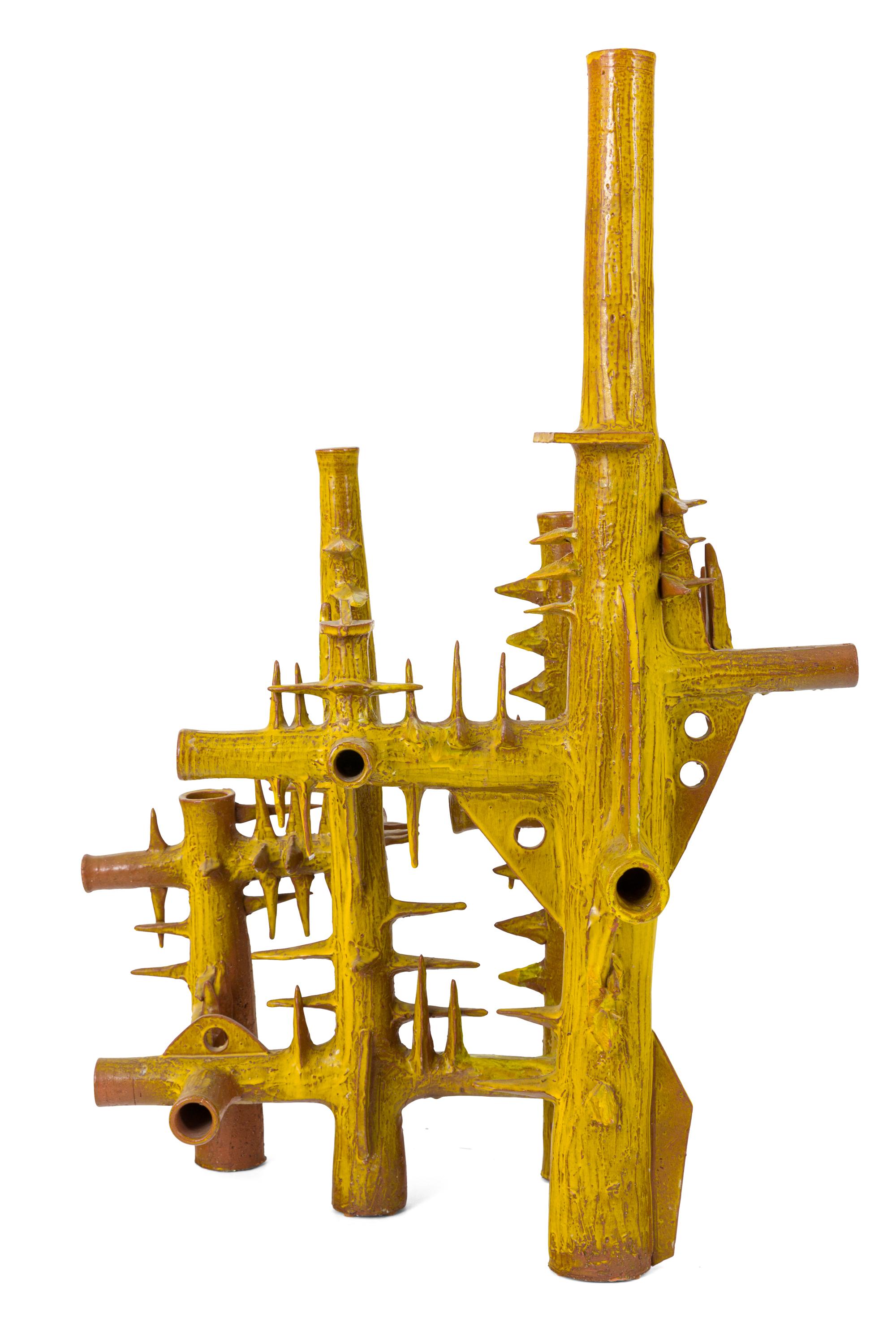 A dynamic sculpture clearly showing the architectural nature of the work. Purchased in France by a private collector of French ceramics. There is an indistinguishable signature on the base of one leg.