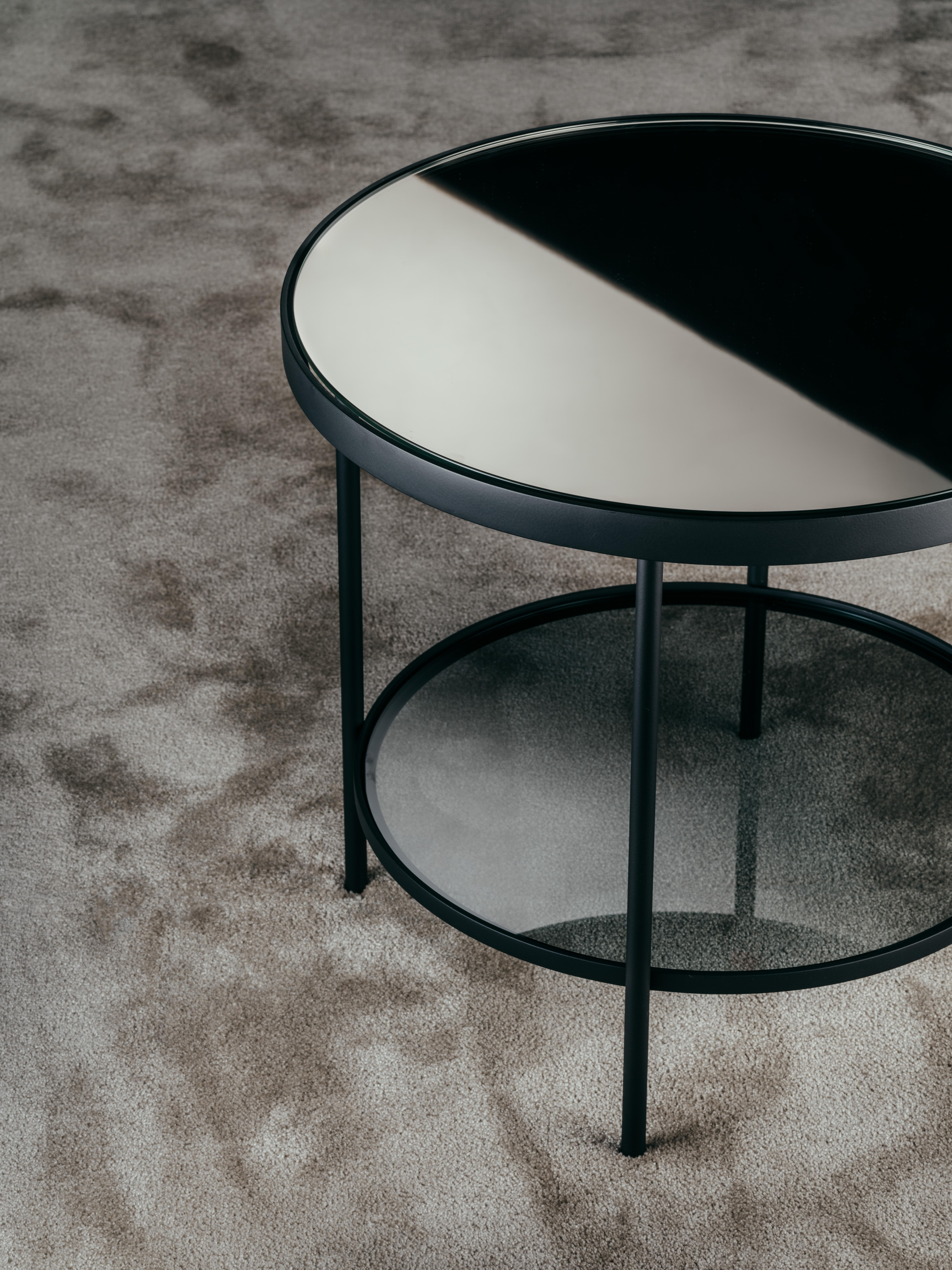 Surround me coffee table is part of the Fleurs DU MAL Capsule Collection.?
Surround me coffee tables are available in two different sizes. They are composed of a circular structure supported by four metal tubular feet. The upper shelf can be in