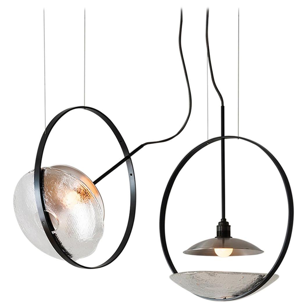 The Surround pendant is a fully adjustable wash light featuring The Studio’s original iron-cast glass. Drawing on a background in theatrical lighting design, the goal was to create a light that projects a smooth and even glow around the space. New