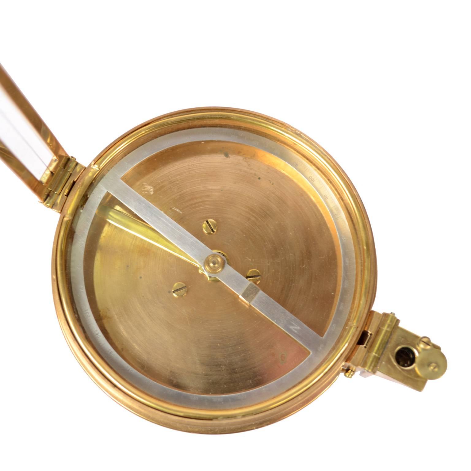 Old survey compass, brass with leather case, signed Troughton & Simms Ltd London, early 1900. Measure: Diameter of compass cm 11.5, height cm 3.2. Very good condition and in order.