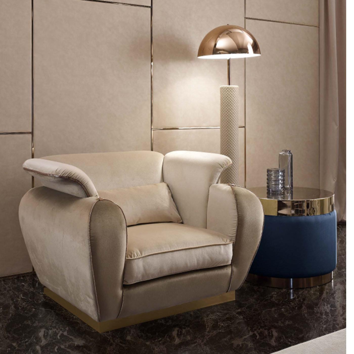 Flaunting a superb aesthetic with a wrap-around back and armrests, this armchair's perfect proportions look both chic and sleek without compromising on comfort. Fully covered in super soft fabric in two neutral hues - cream from the interior and