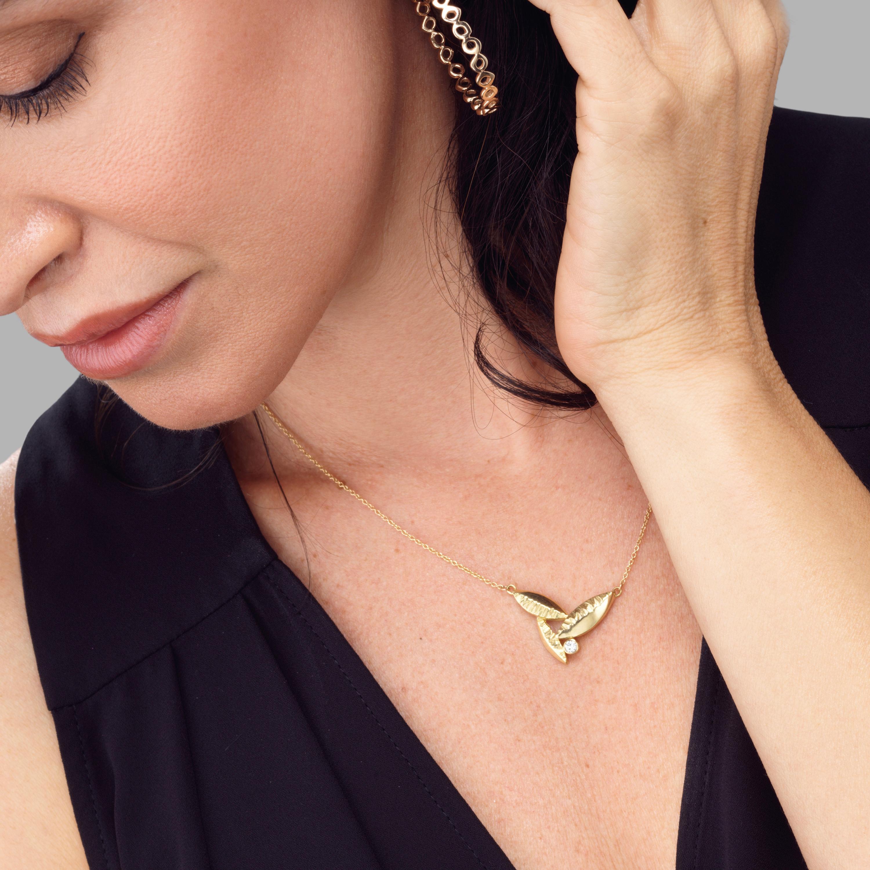 Our Susan Crow Studio Flora Leaf Pendant is hand carved and cast in 18kt Fairmined yellow gold with a handset 3mm round white reclaimed full cut diamond. 

This perfectly sized pendant will be difficult to not put on every day.

º Measurements: