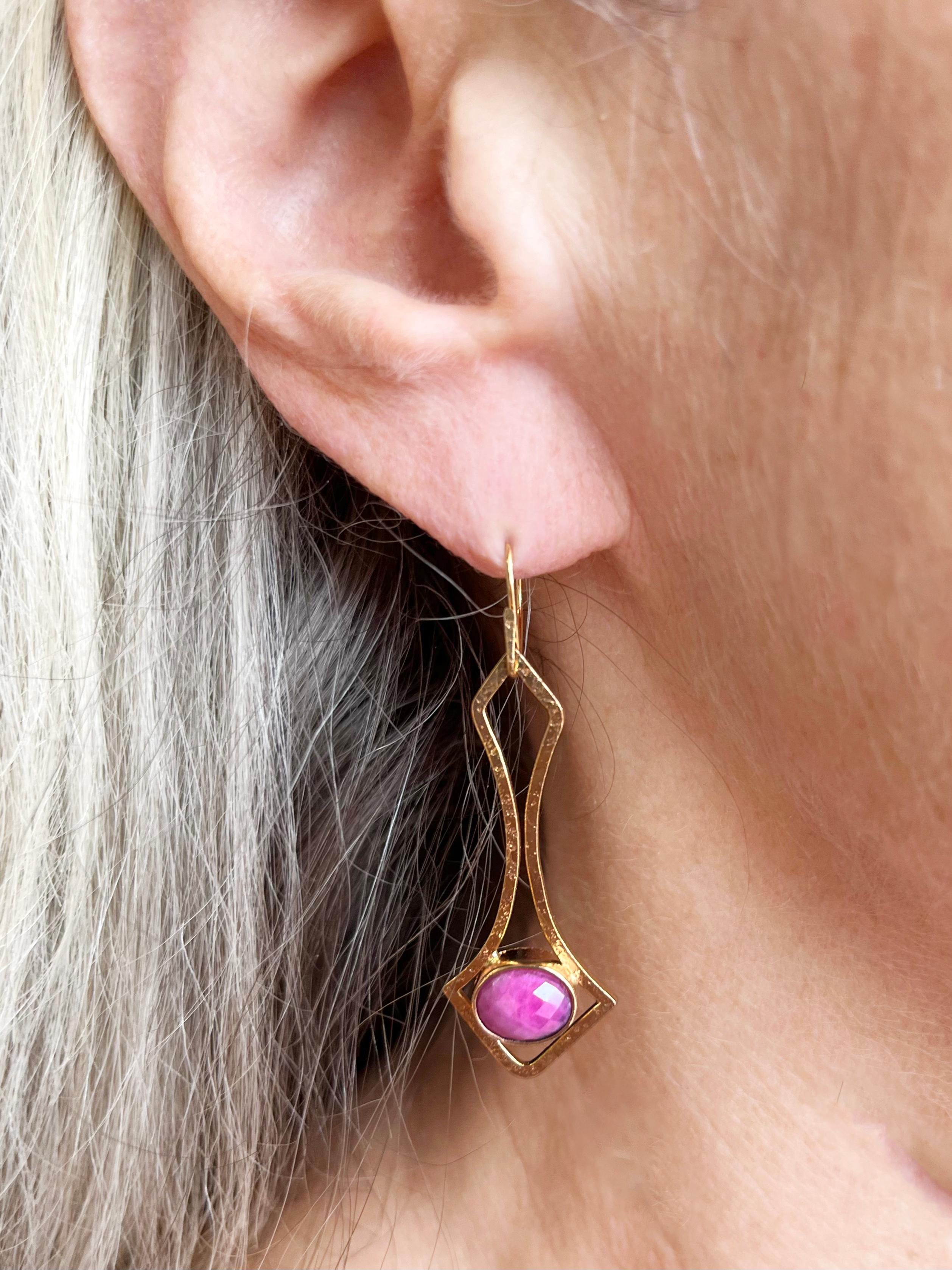 These bodacious beauties -  our one-of-a-kind 18kt Fairmined Yellow Gold and Oval Rose-Cut Ruby Earrings are a show stopper. The Rubies are the luscious color of pink peonies surrounded by a hand hammered fine gold texture that makes the 18kt yellow