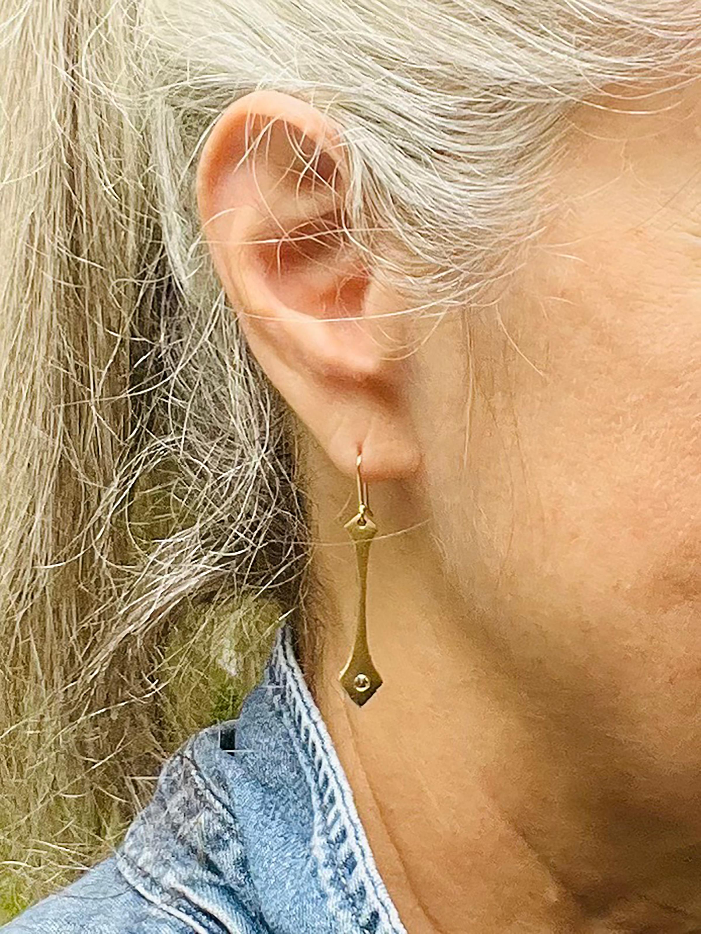 Our Diamond and Gold Modern Drop Earrings are inspired by the textures of grass blowing on the edge of a beach sand dune. 

Features
º Modern drop earrings are hand carved and cast

º Made from recycled 14kt recycled yellow gold

º Reclaimed 2.5mm