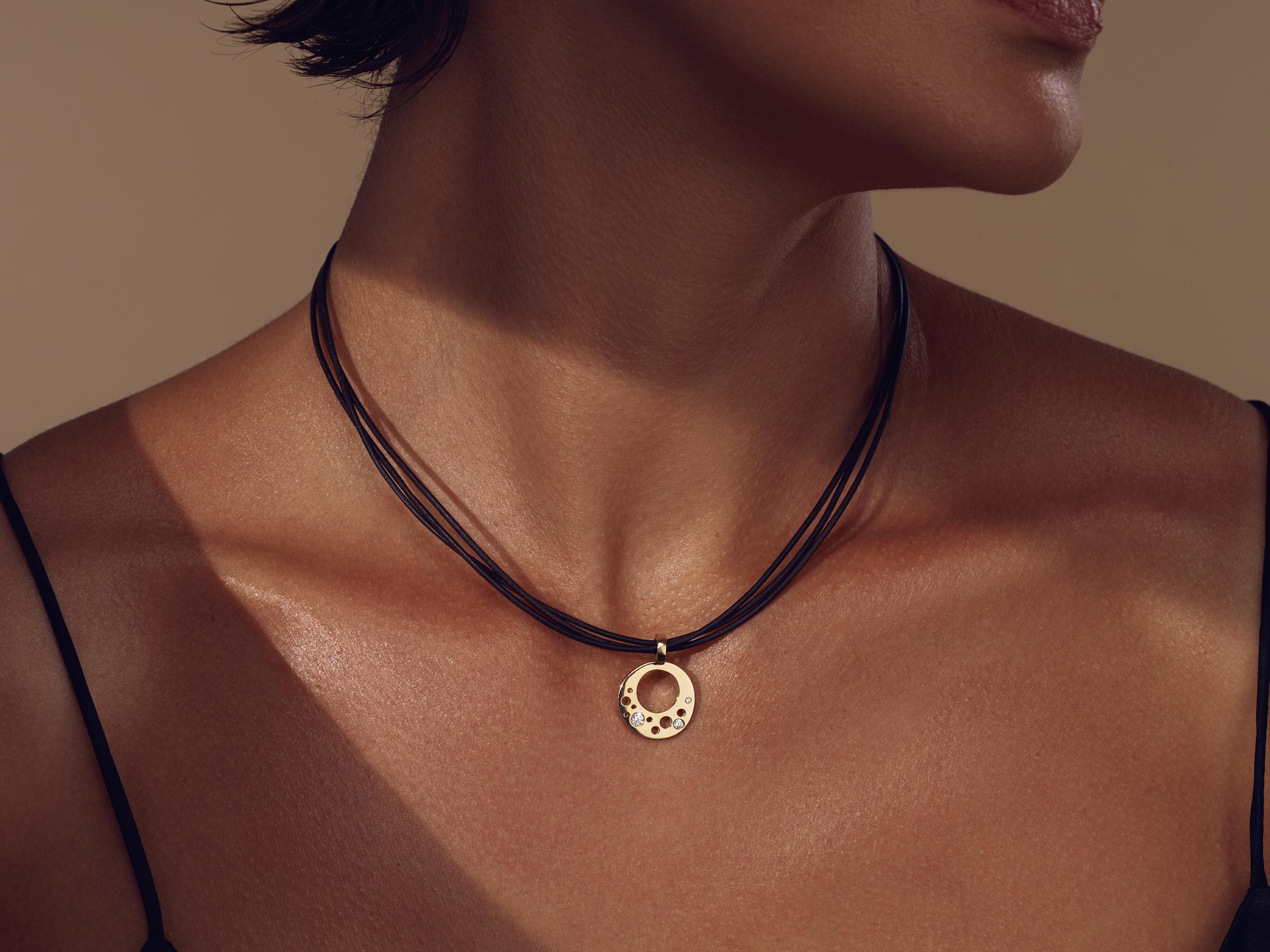 Crafted in 18kt Certified FAIRMINED Yellow Gold, and post-consumer recycled mined diamonds, the CIRCLE_INFINITE Pendant tells its own story of 'Less is More' when it comes to beauty and sophistication. 
Minimalism and functionality blend industrial