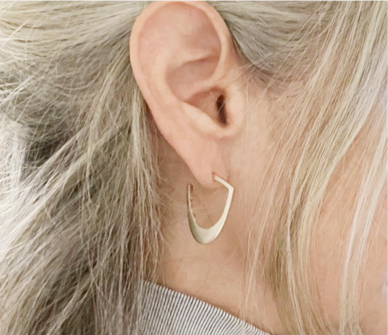 If you are the person that wears earrings every day, our Sterling Silver Hoops are just what you need. Their sensuous soft shapes have a wonderful texture on the inside creating a juxtaposition that adds interest and visibility in a casual yet