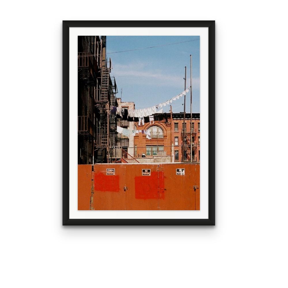 Williamsburg 10 is a contemporary urban color photograph by Susan Daboll. Daboll makes use of the borough's bold lines and colours to craft a thoughtful composition. 

Artist Susan Daboll was born in South Weymouth, Massachusetts, grew up in