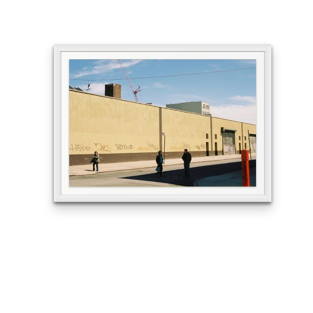 Williamsburg 11 is a contemporary urban colour photograph by Susan Daboll. Daboll makes use of the borough's bold lines and colours to craft a thoughtful composition. 

Artist Susan Daboll was born in South Weymouth, Massachusetts, grew up in
