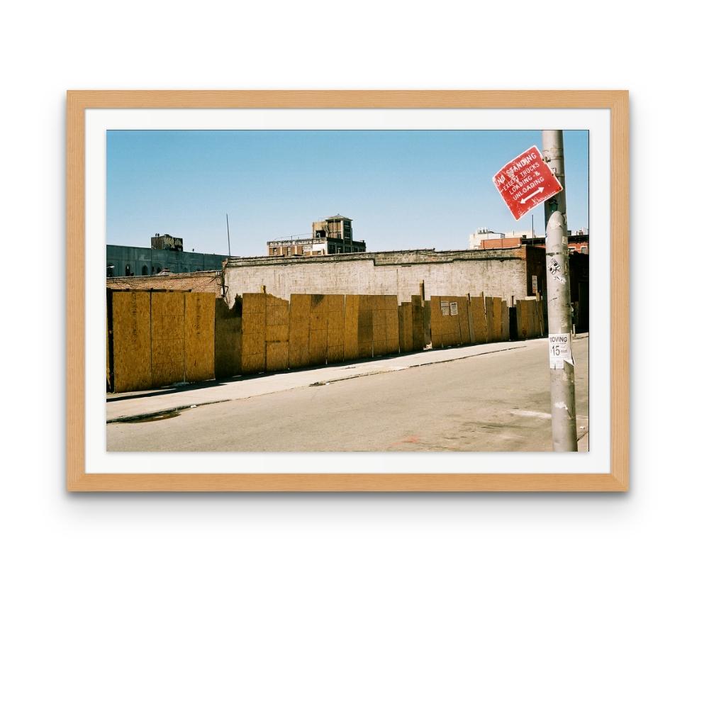 Williamsburg 17 is a contemporary urban colour photograph by Susan Daboll. Daboll makes use of the borough's bold lines and colours to craft a thoughtful composition. 

Artist Susan Daboll was born in South Weymouth, Massachusetts, grew up in
