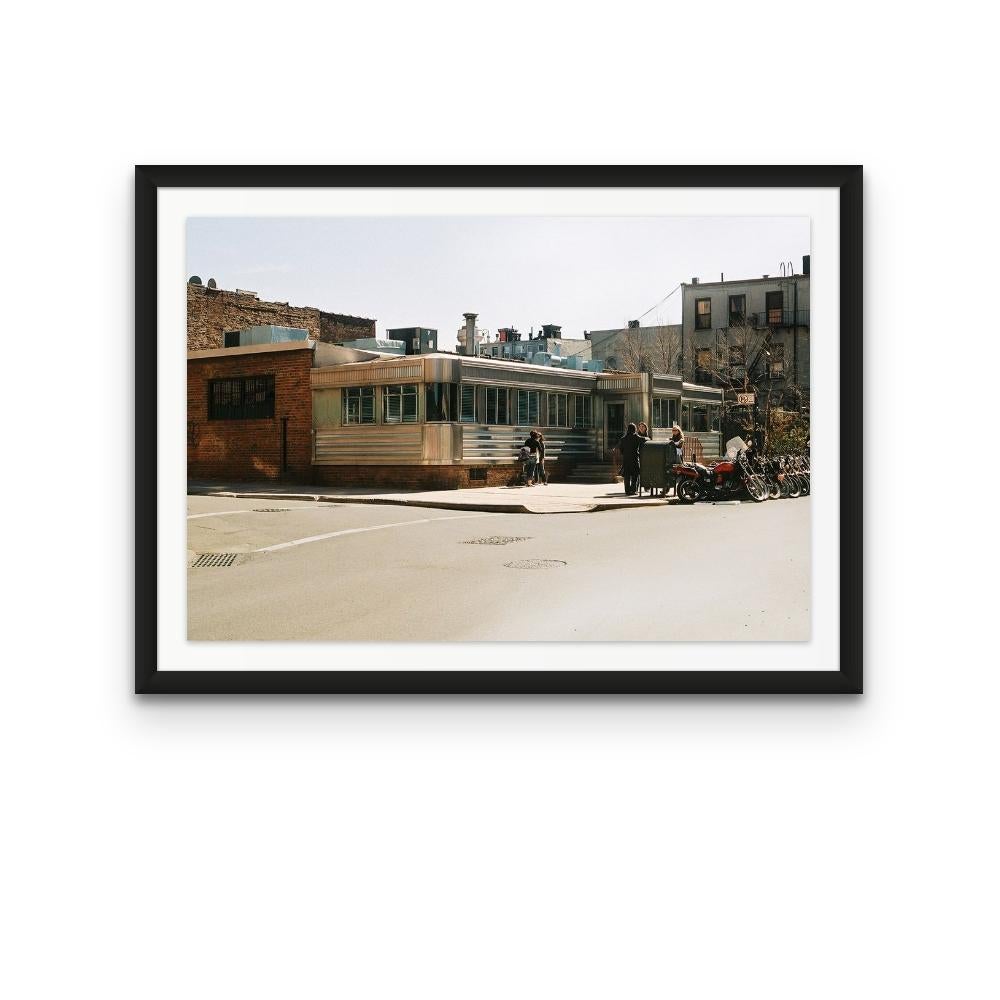Williamsburg 23 is a contemporary urban color photograph by Susan Daboll. Daboll makes use of the borough's bold lines and colours to craft a thoughtful composition. 

Artist Susan Daboll was born in South Weymouth, Massachusetts, grew up in