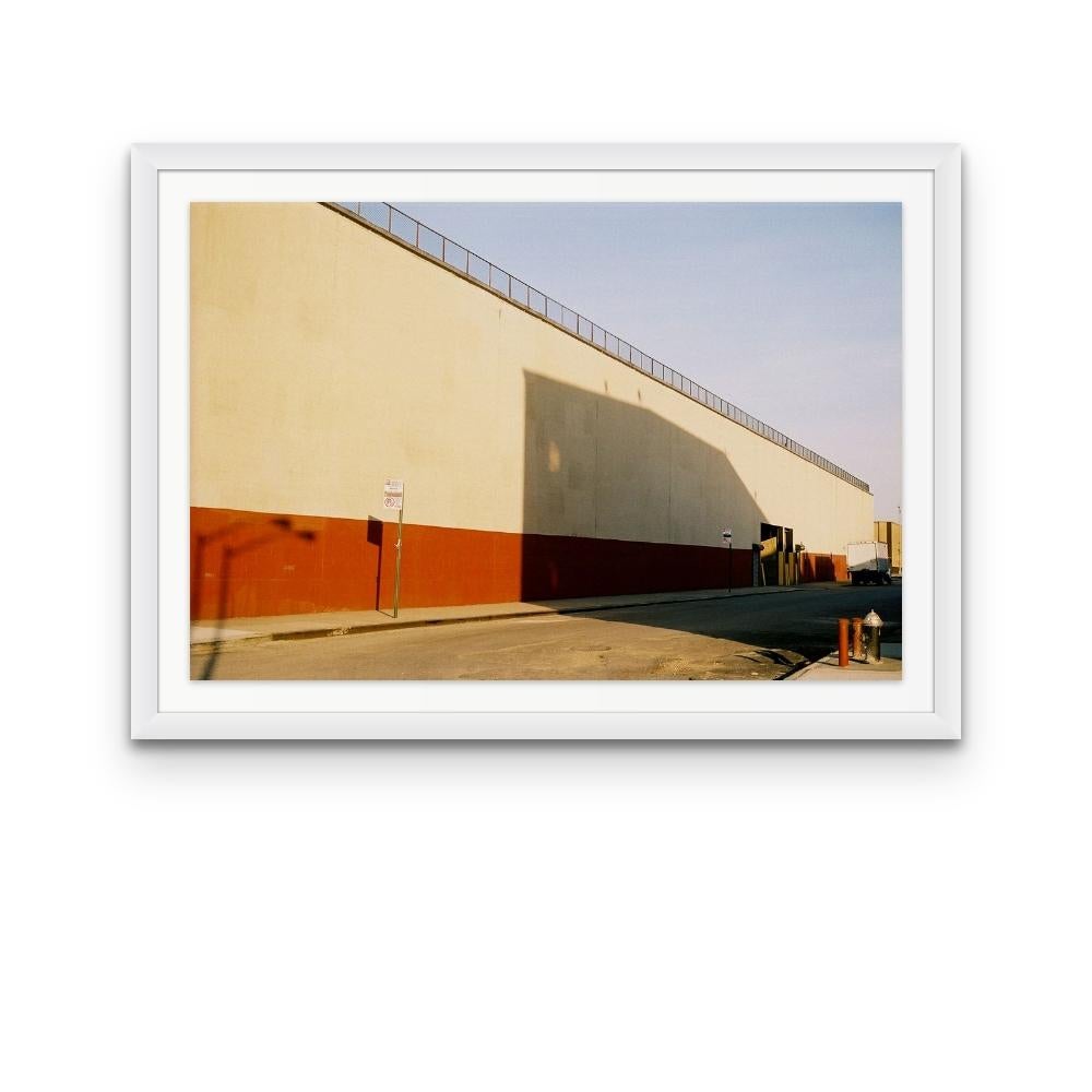 Williamsburg 24 is a contemporary urban color photograph by Susan Daboll. Daboll makes use of the borough's bold lines and colours to craft a thoughtful composition. 

Artist Susan Daboll was born in South Weymouth, Massachusetts, grew up in