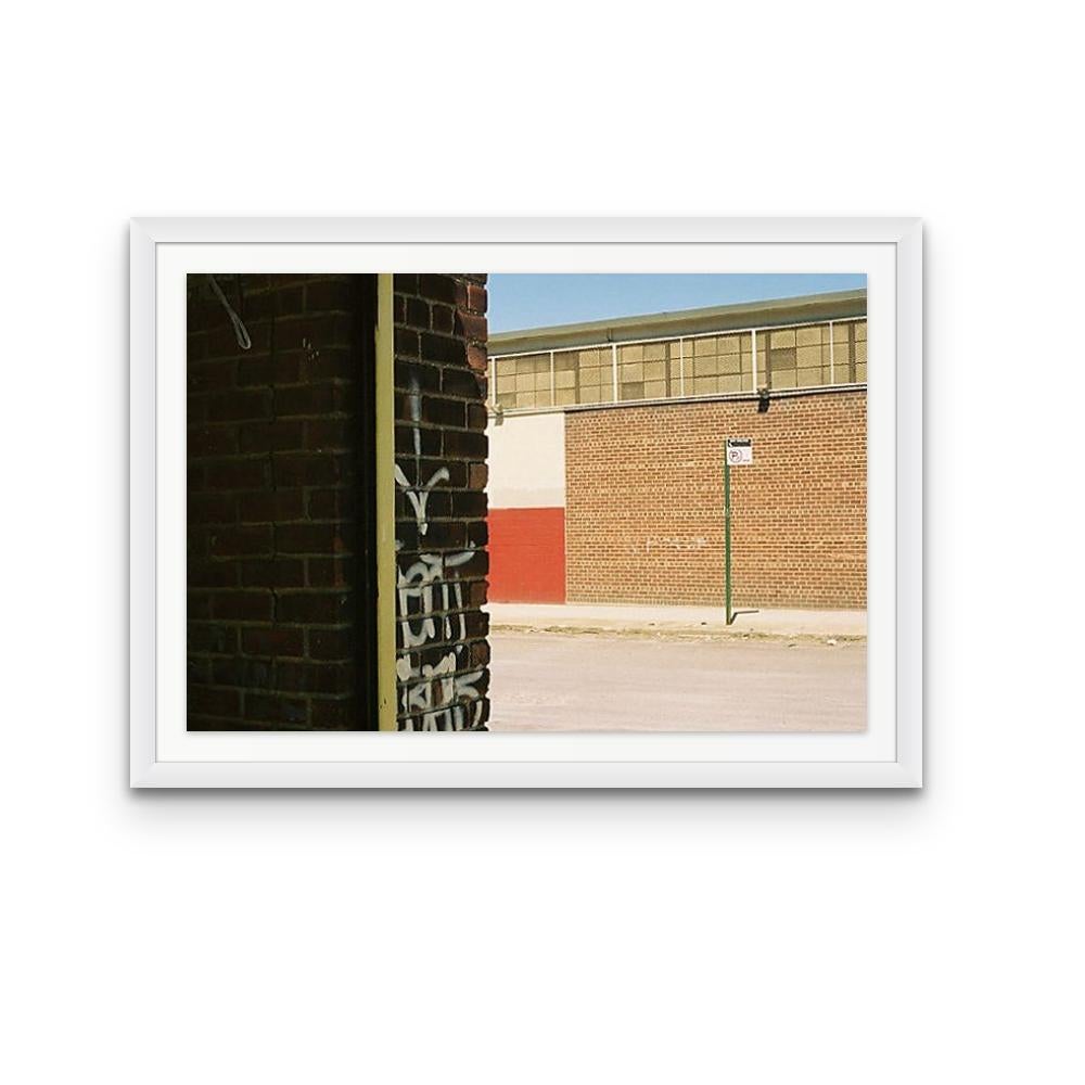 Williamsburg 34 is a contemporary urban color photograph by Susan Daboll. Daboll makes use of the borough's bold lines and colours to craft a thoughtful composition. 

Artist Susan Daboll was born in South Weymouth, Massachusetts, grew up in