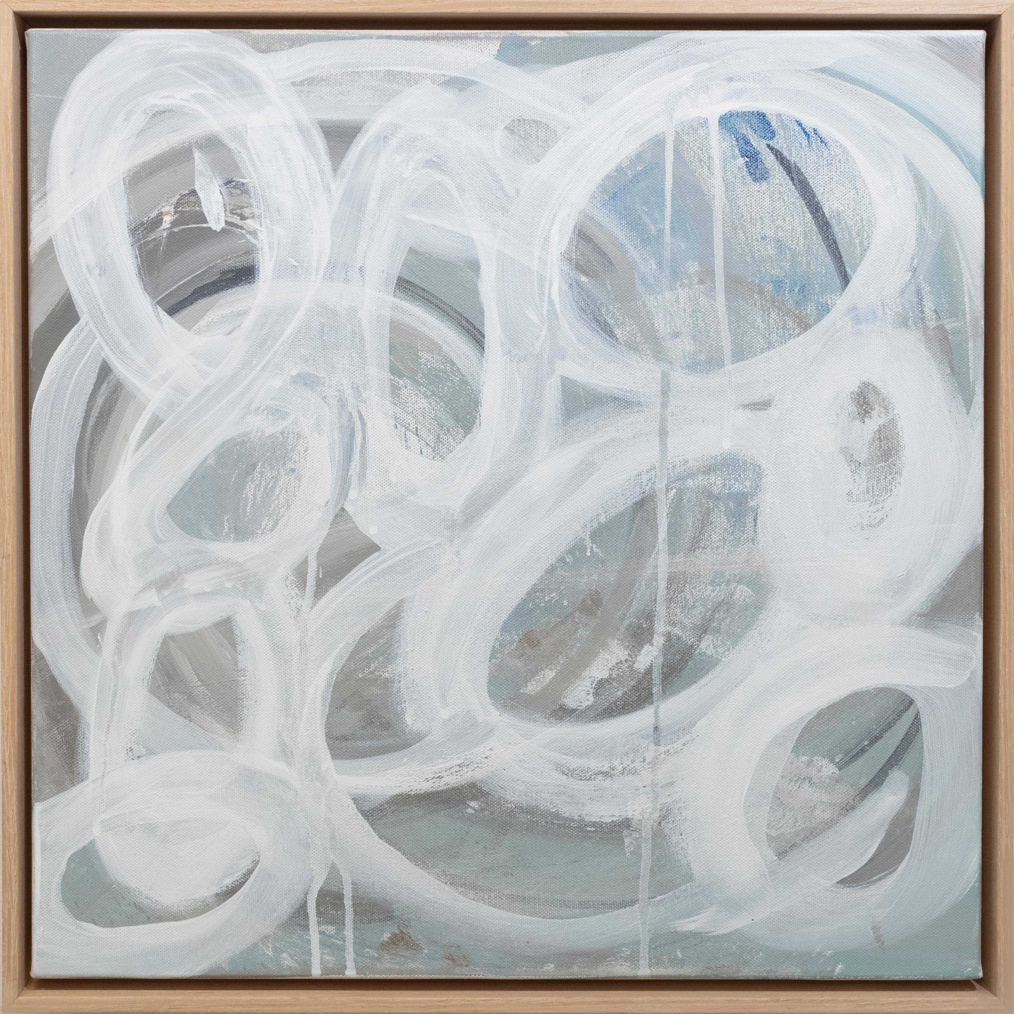 This abstract painting by Sue De Chiara is made with acrylic paint on canvas. It features a light blue-grey palette, with white circular shapes applied in light, loose strokes across the composition. The painting is professionally framed in a light