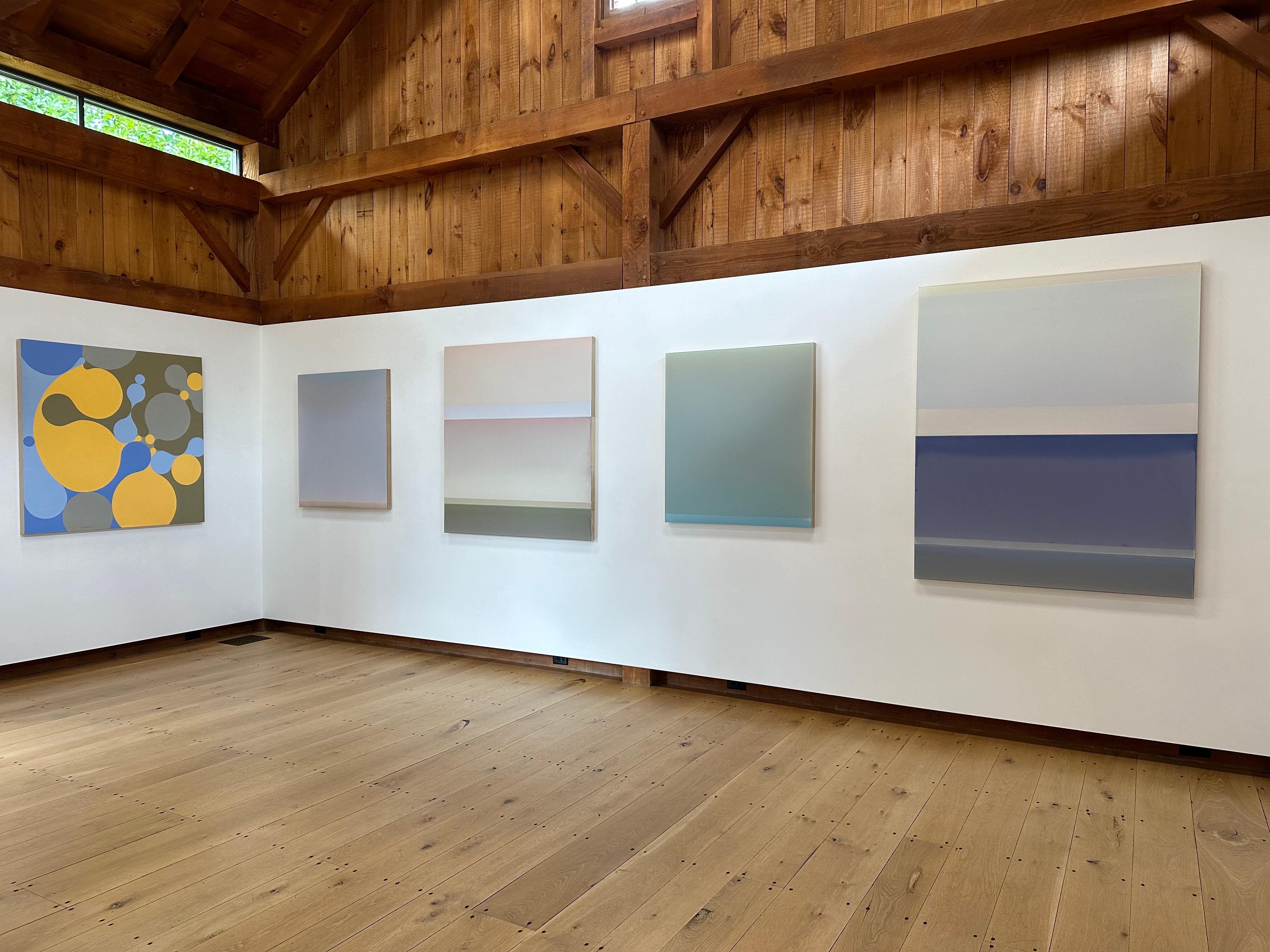 Matte but luminous, Outland No. 47 by Susan English is a wonderful play of color, light, and composition. Hues of icy gray blue meet and merge, offset by beige brown at the bottom and bright sky blue at the top. The layers of English's tinted