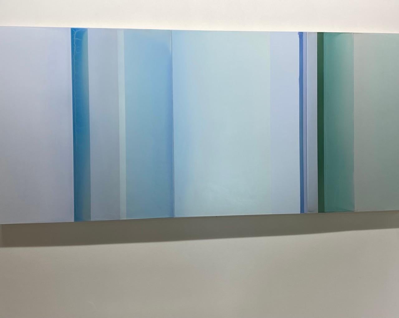 The surface of Shades of Ocean by Susan English is a wonderful play of color, light, and composition. Hues of soft blue, pale teal bluish green, gray periwinkle blue, cerulean and hunter green meet and merge in softly transitioning planes. The
