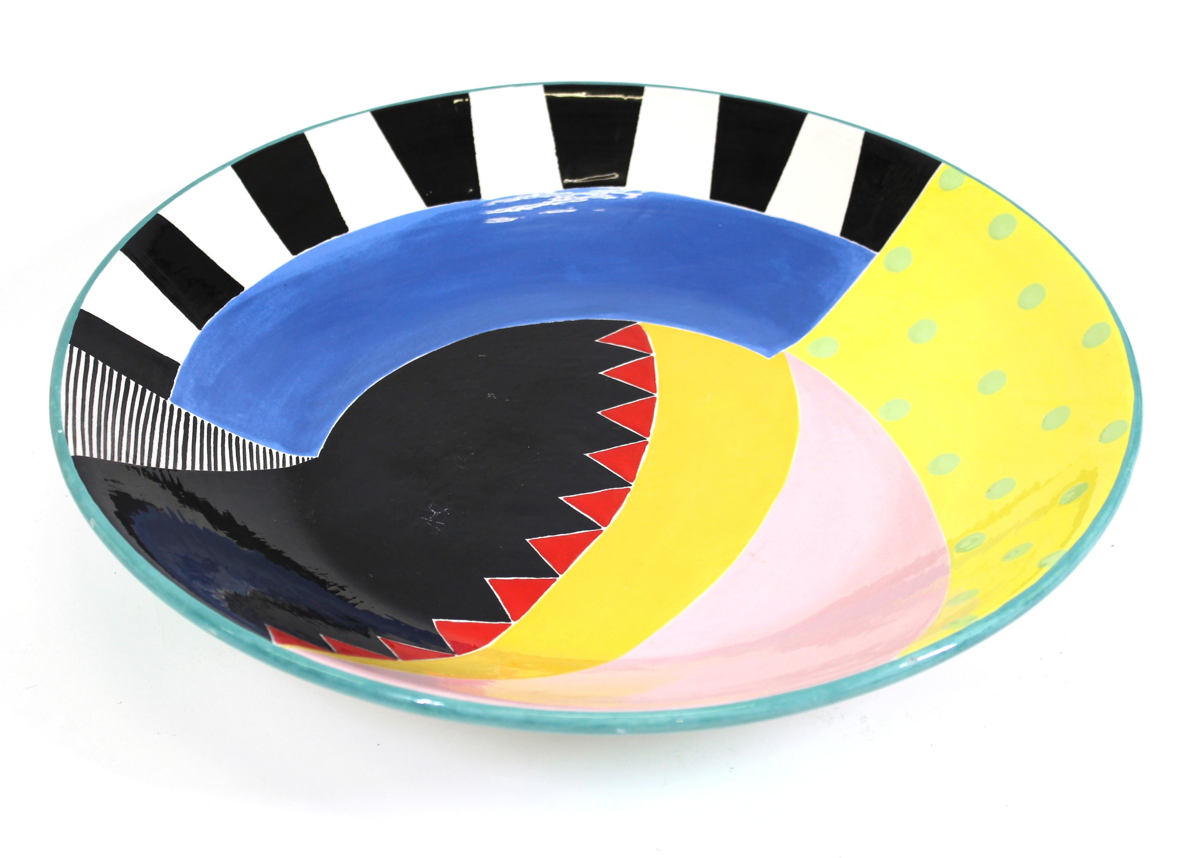 Susan Eslick American Postmodern art pottery hand painted charger plate, signed and dated 1989.